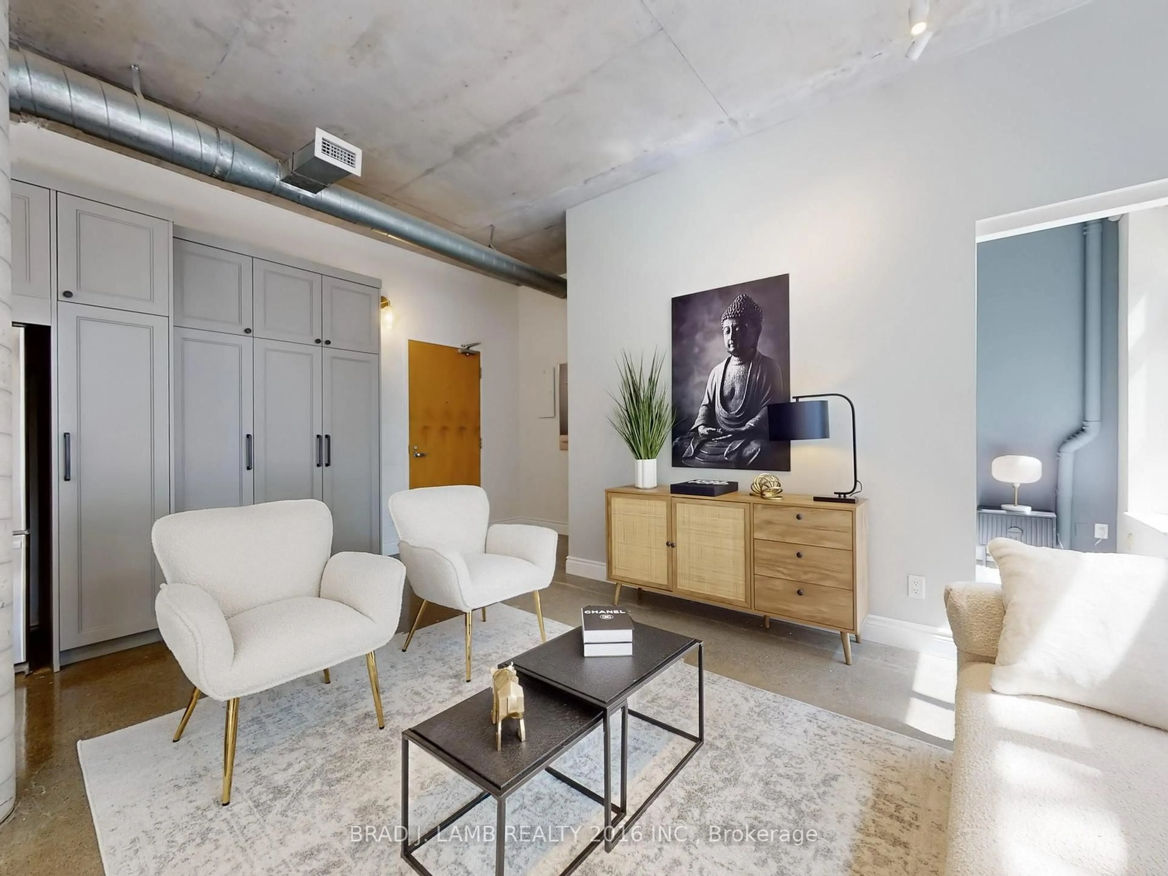 Living room with furniture, cement floor for 29 Camden St #305, Toronto Ontario M5V 3N3