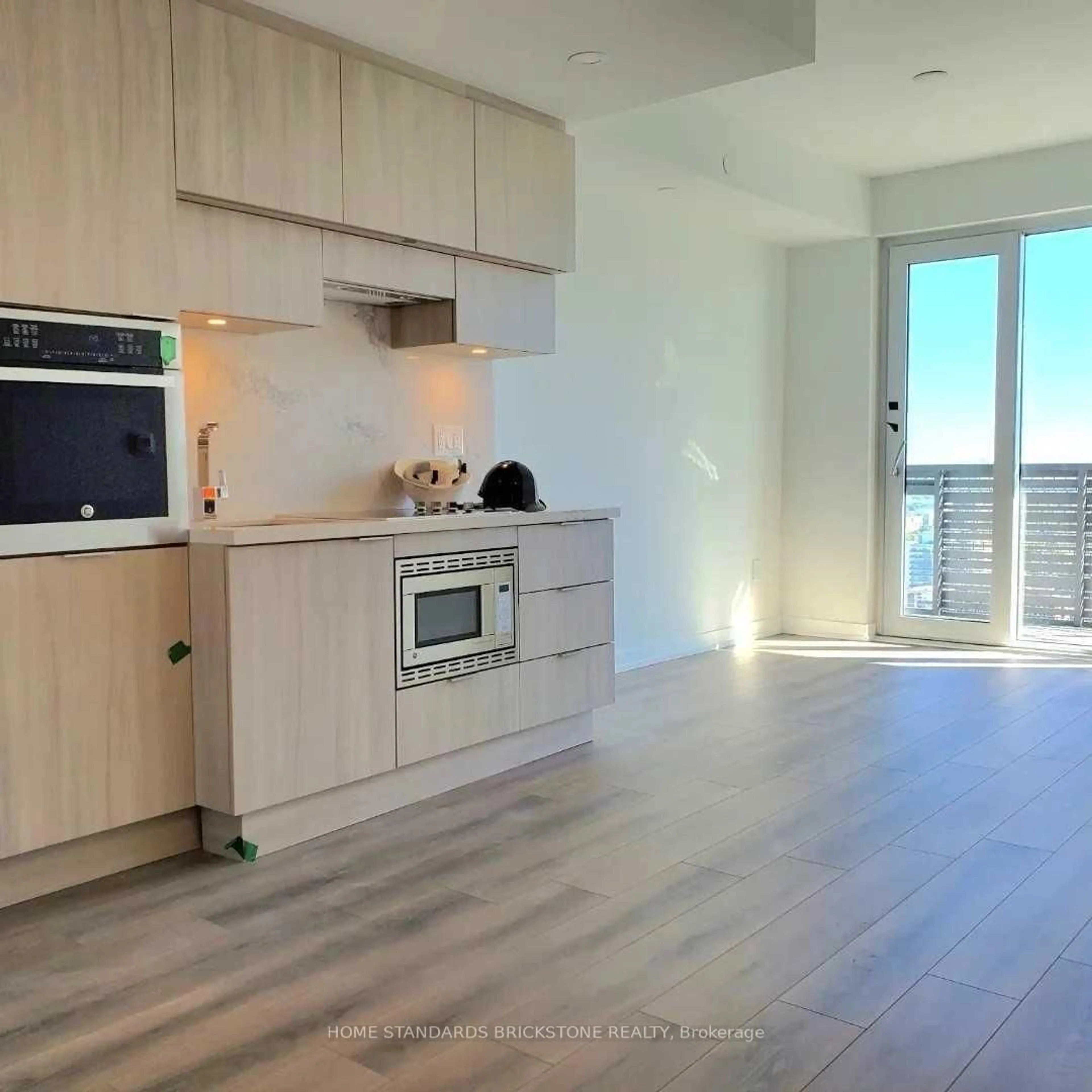 Open concept kitchen, wood/laminate floor for 39 Roehampton Ave #2502, Toronto Ontario M4P 0G1