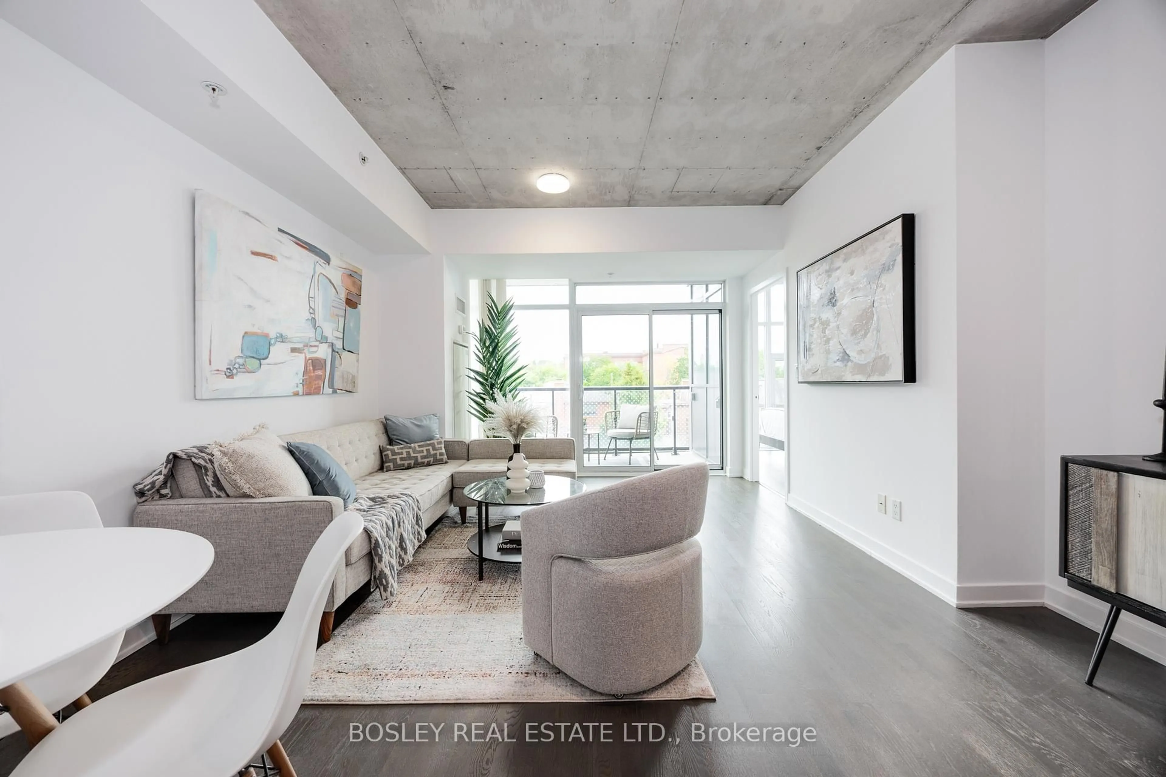 Living room with furniture, cement floor for 109 Ossington Ave #312, Toronto Ontario M6J 2Z2