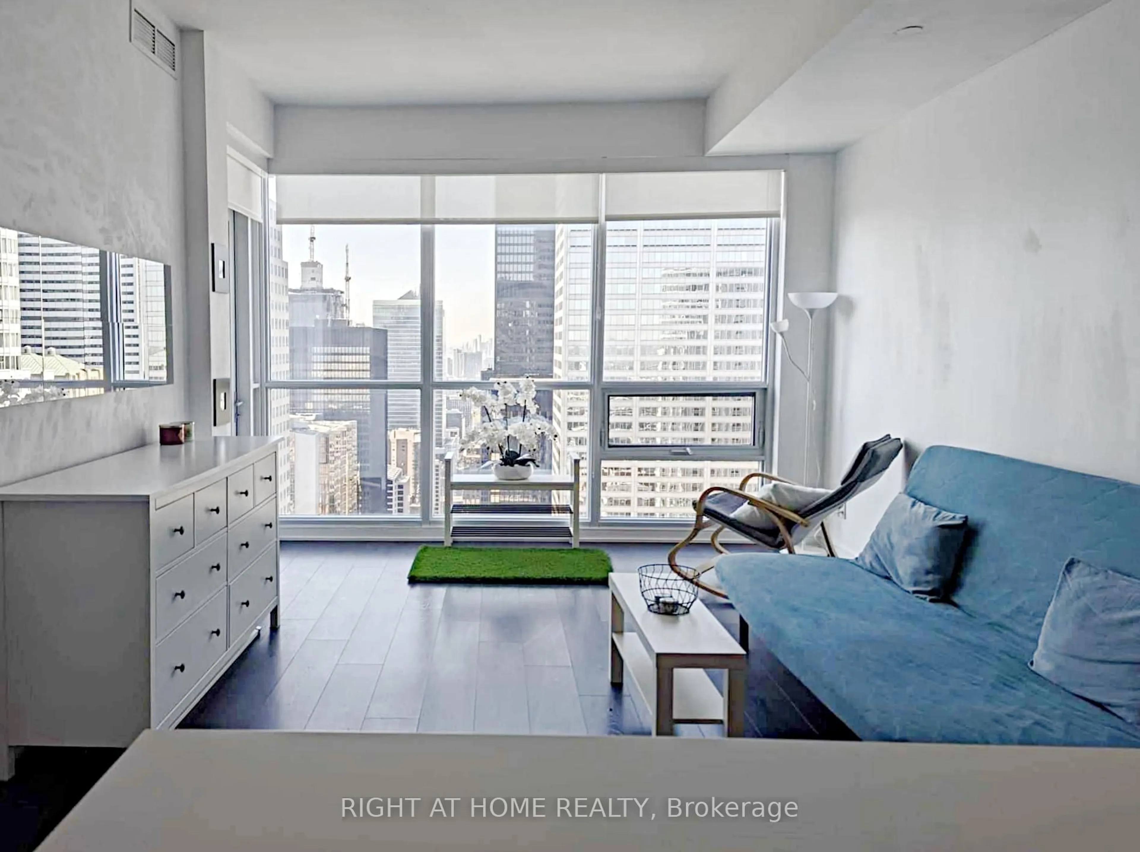 Living room with furniture, unknown for 88 Scott St #4707, Toronto Ontario M5E 0A9