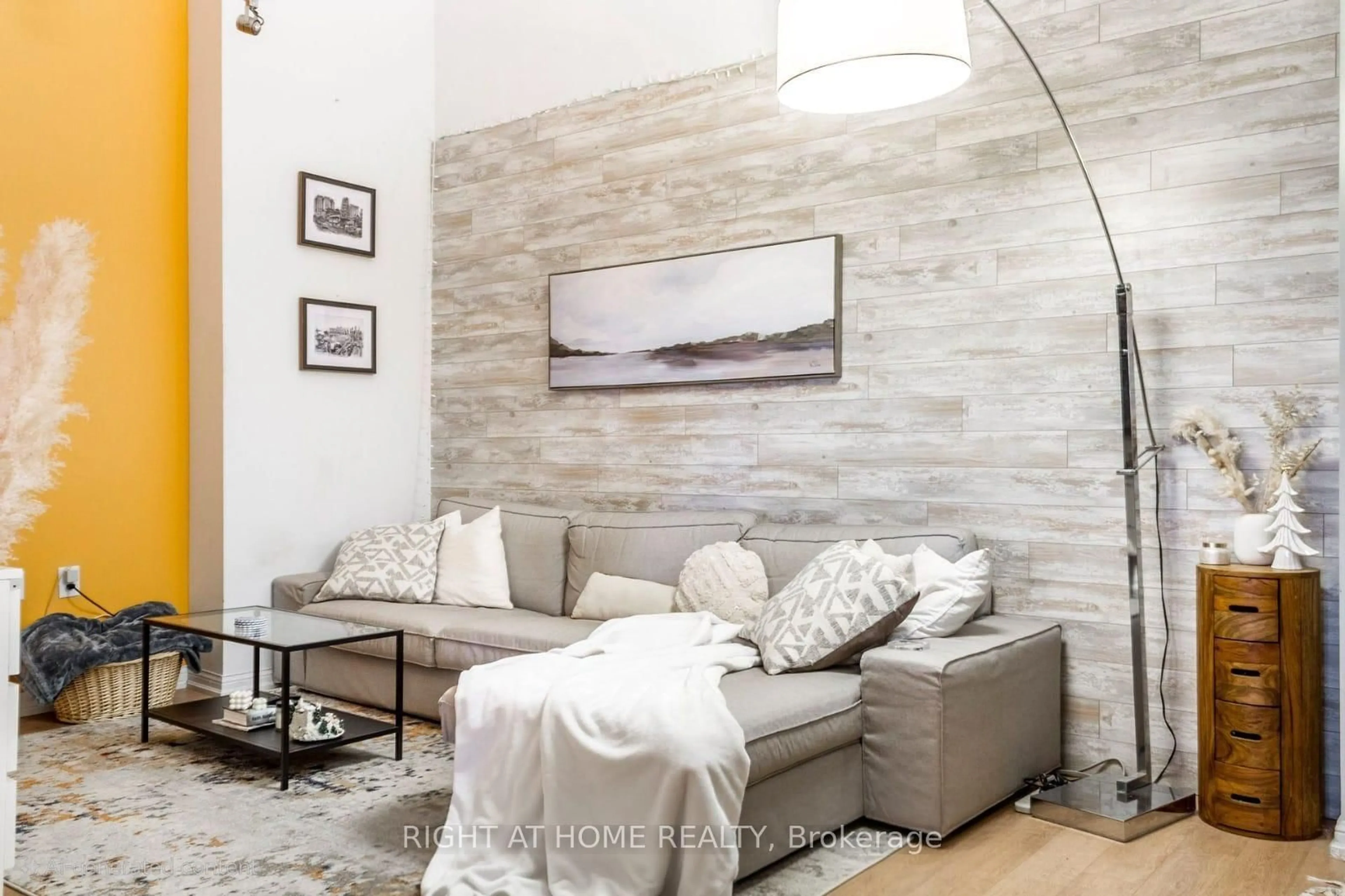 Living room with furniture, wood/laminate floor for 125 Western Battery Rd #214, Toronto Ontario M6K 3R8