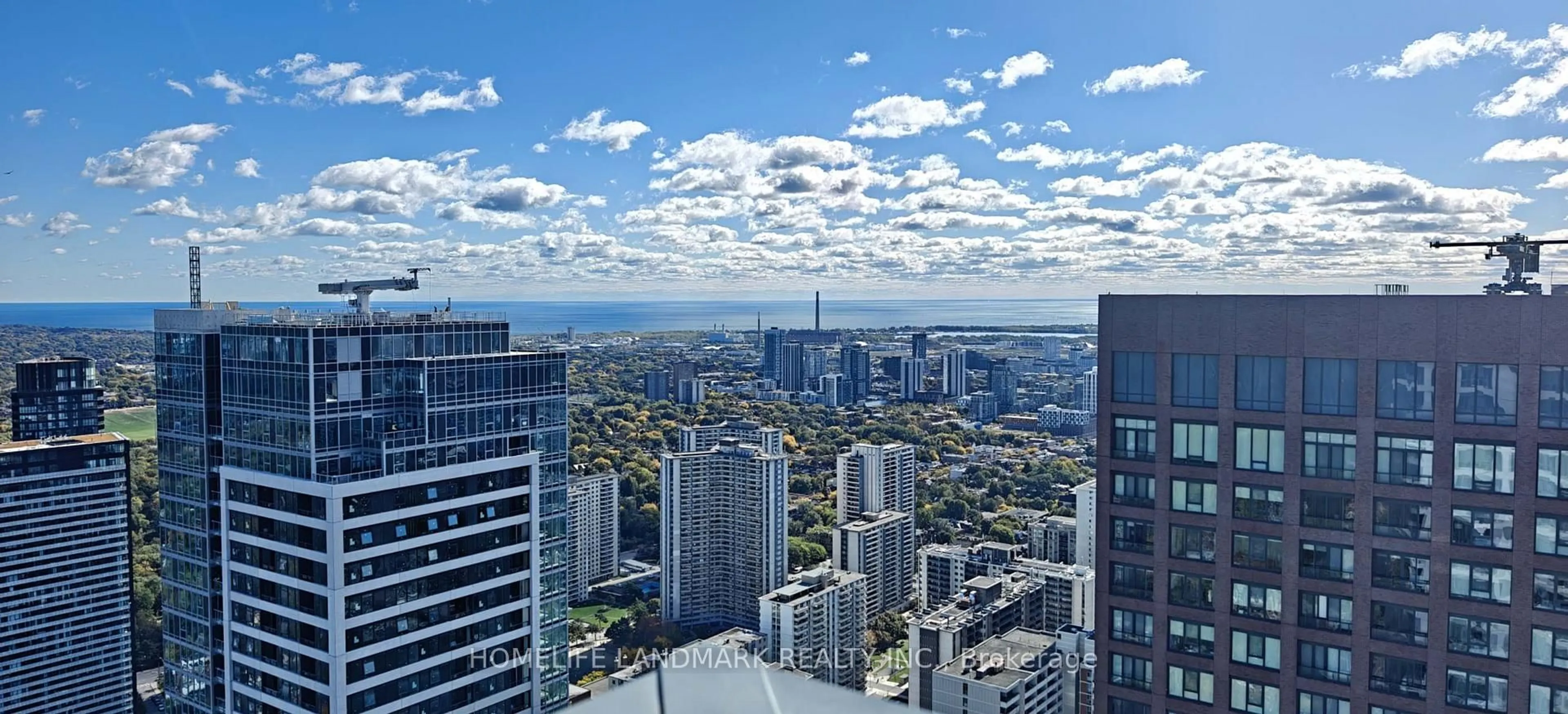 A pic from outside/outdoor area/front of a property/back of a property/a pic from drone, city buildings view from balcony for 395 Bloor St #5401, Toronto Ontario M4W 0B4