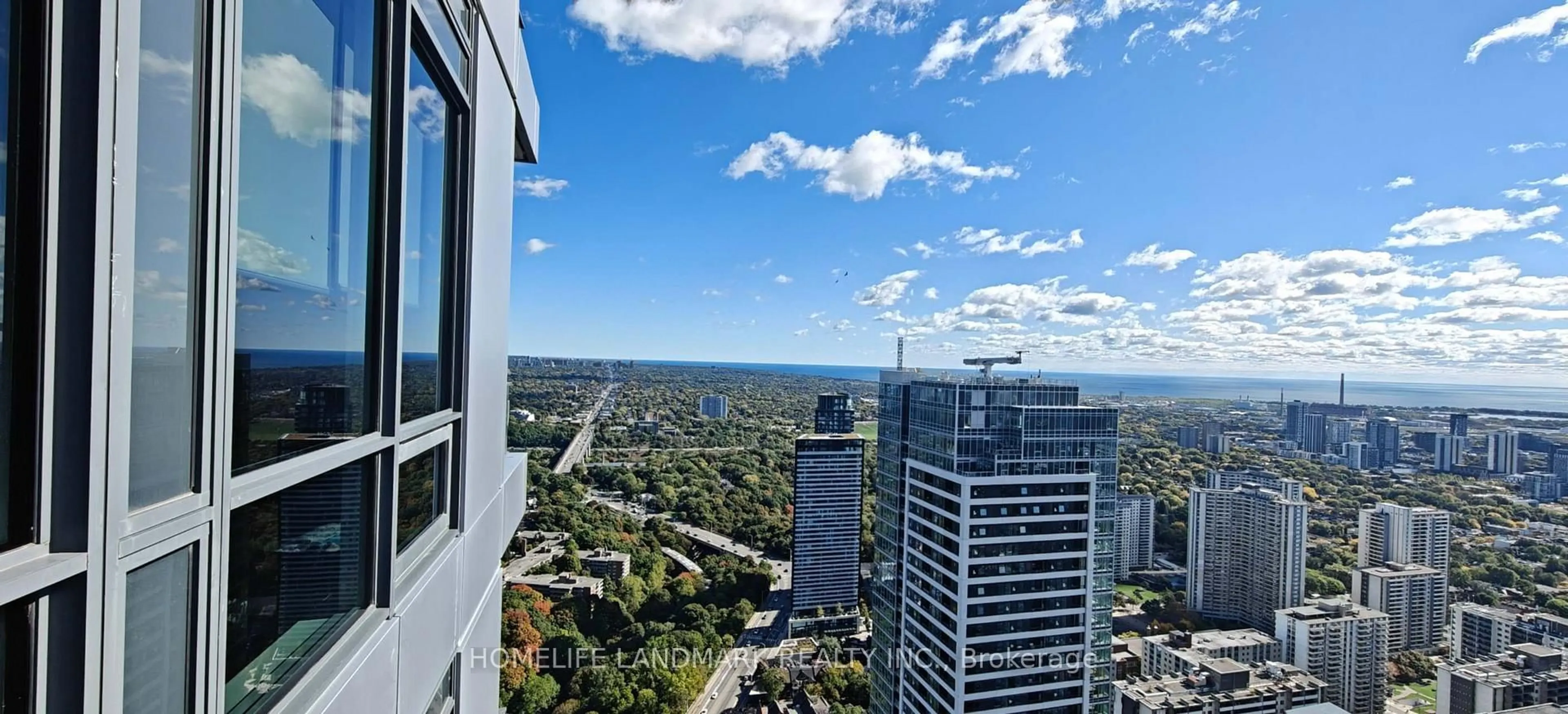 A pic from outside/outdoor area/front of a property/back of a property/a pic from drone, city buildings view from balcony for 395 Bloor St #5401, Toronto Ontario M4W 0B4