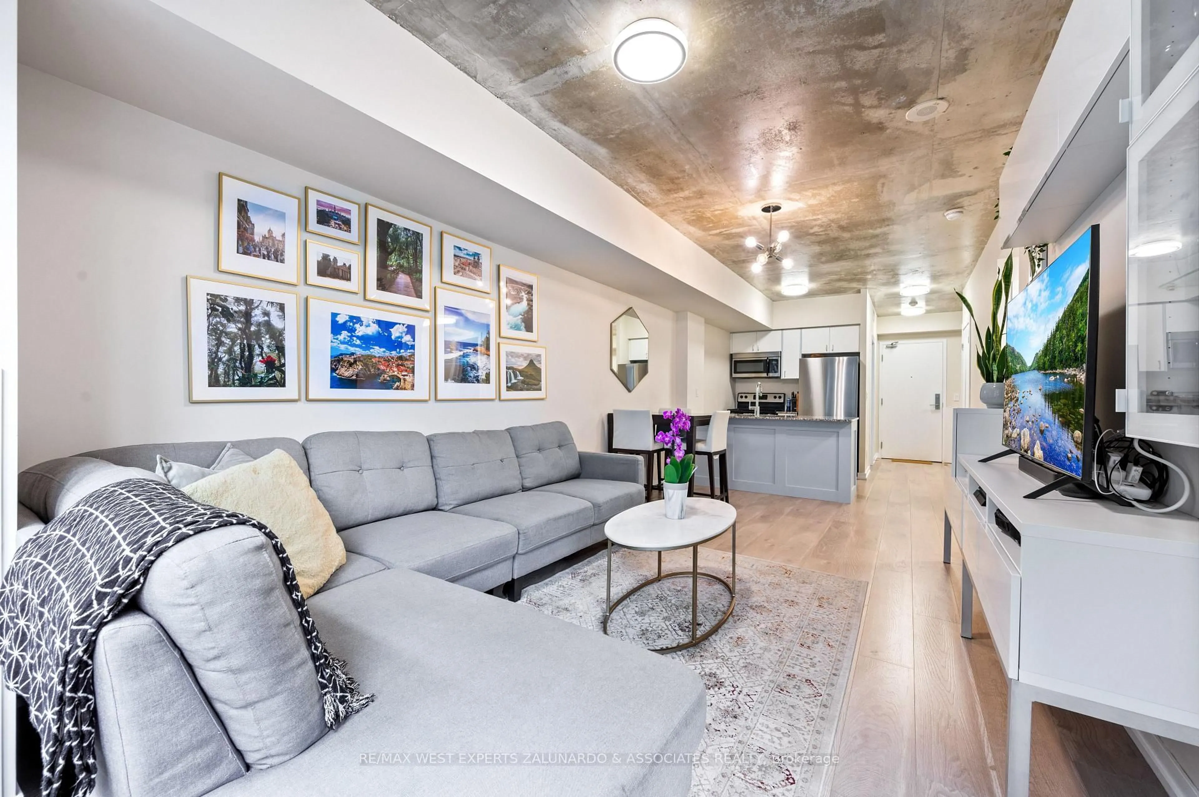 Living room with furniture, cement floor for 59 East Liberty St #315, Toronto Ontario M6K 3R1