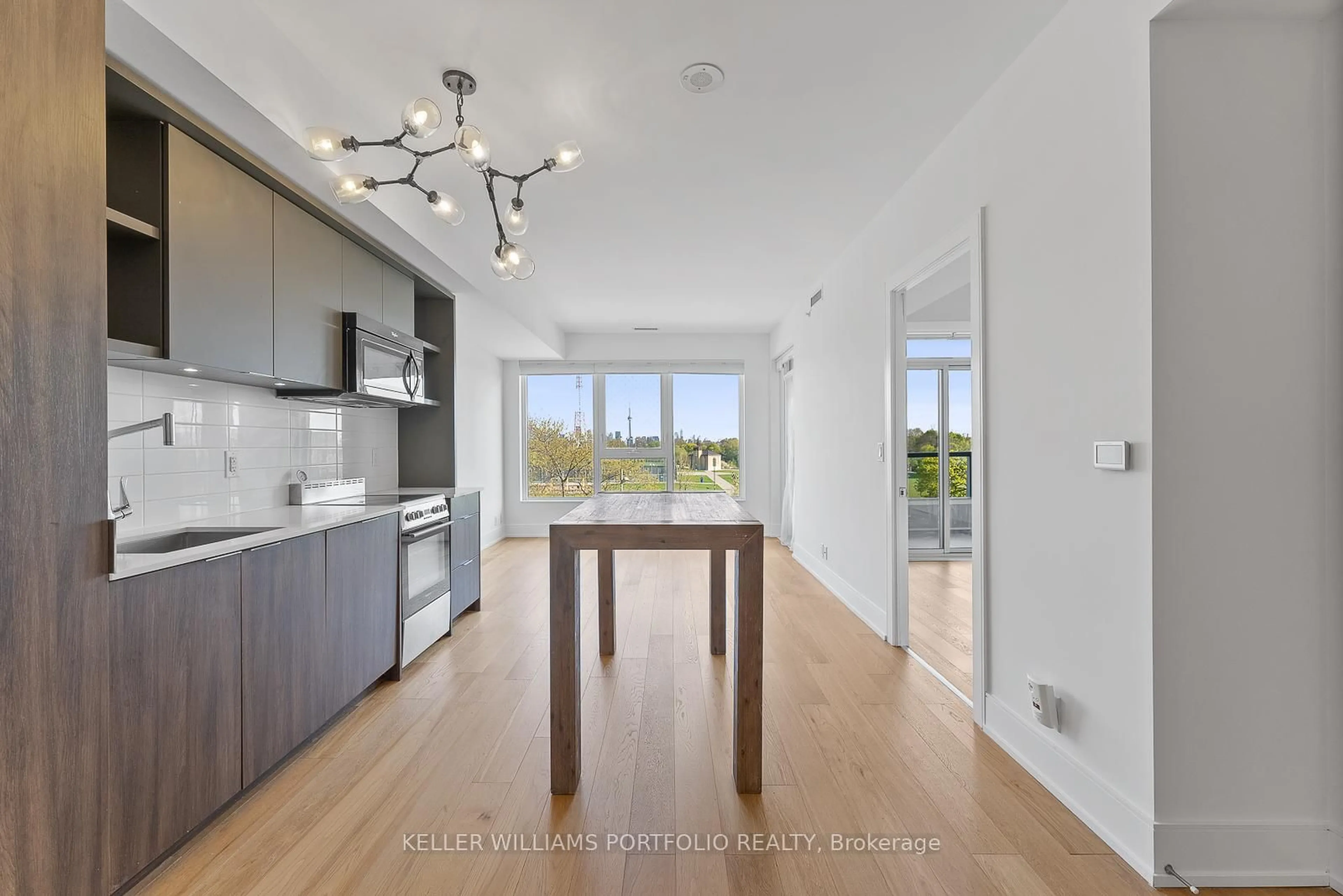 Open concept kitchen, wood/laminate floor for 6 Parkwood Ave #310, Toronto Ontario M4V 2W8