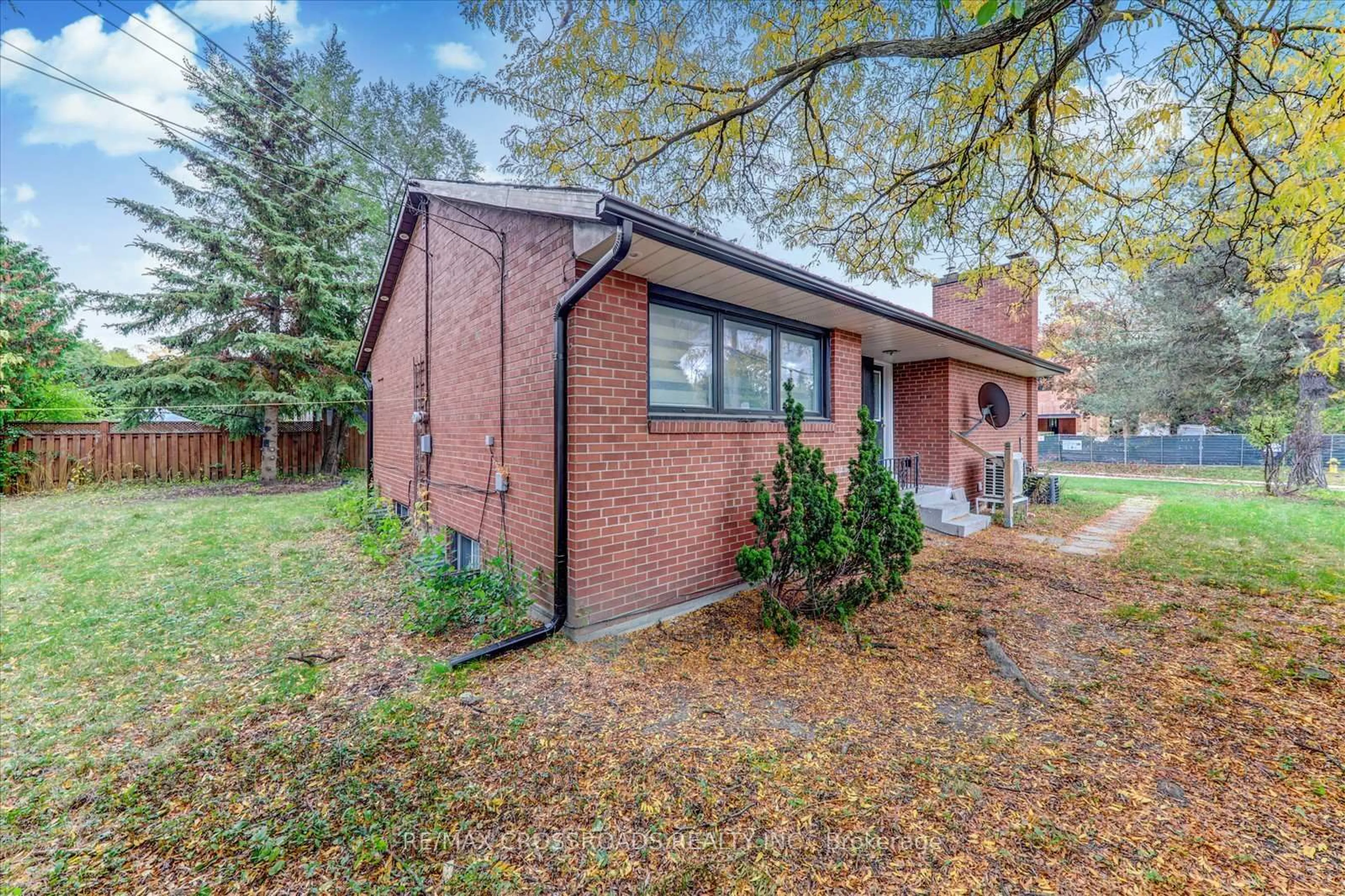 Home with brick exterior material, street for 2 Tangmere Rd, Toronto Ontario M3B 2N1