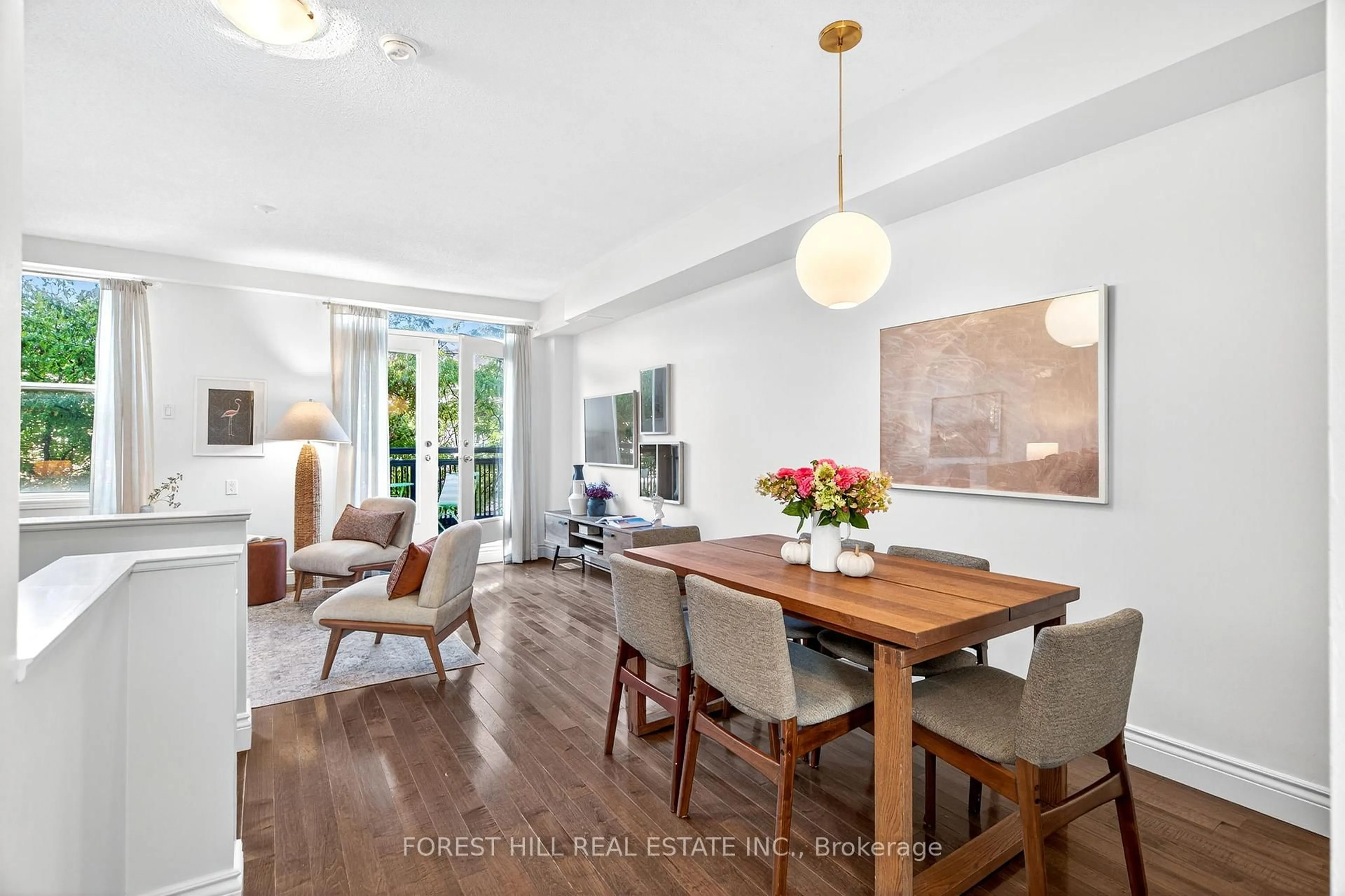 Dining room, wood/laminate floor for 55 Halton St #103, Toronto Ontario M6J 1R5