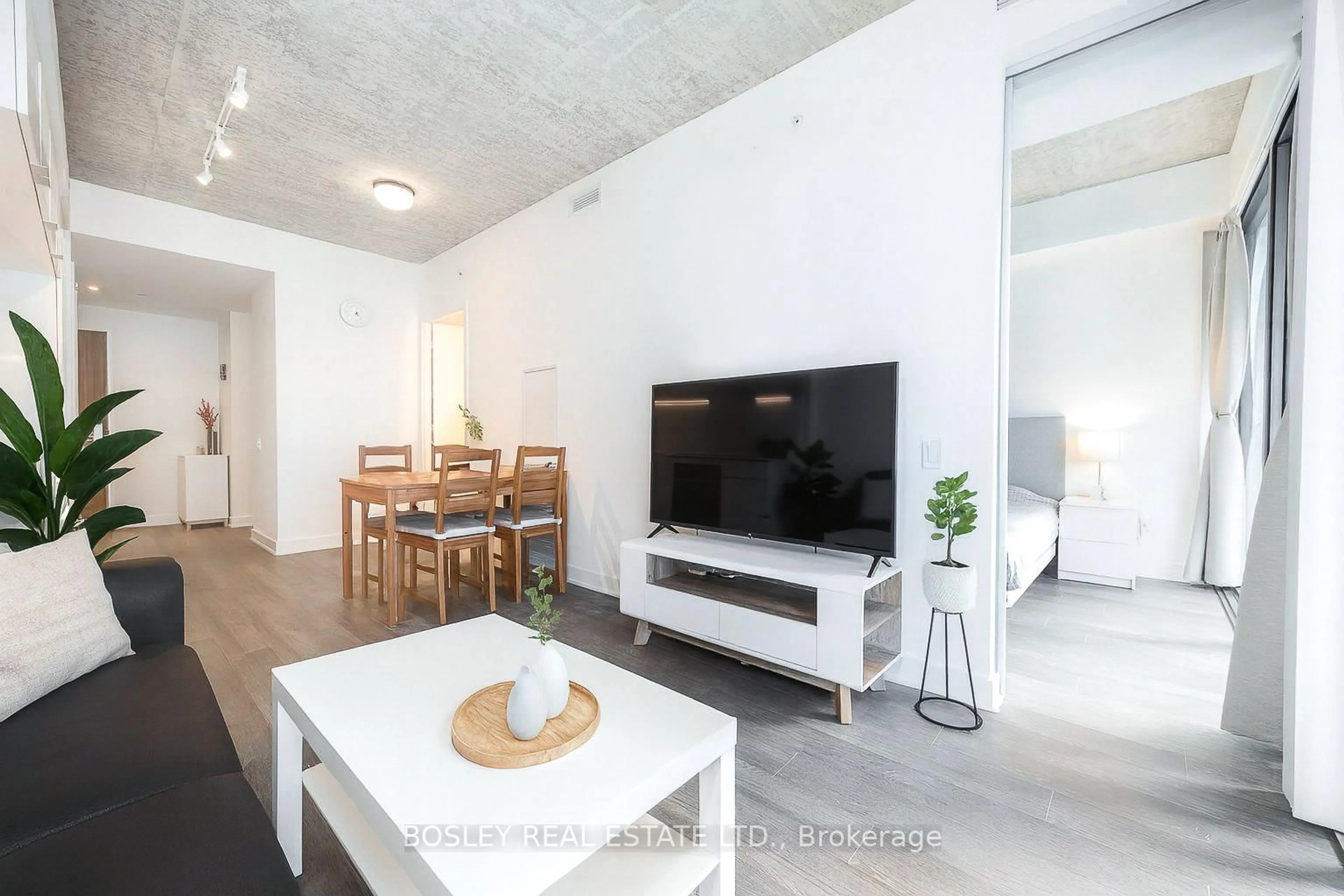 Living room with furniture, cement floor for 185 Roehampton Ave #2112, Toronto Ontario M4P 0C6