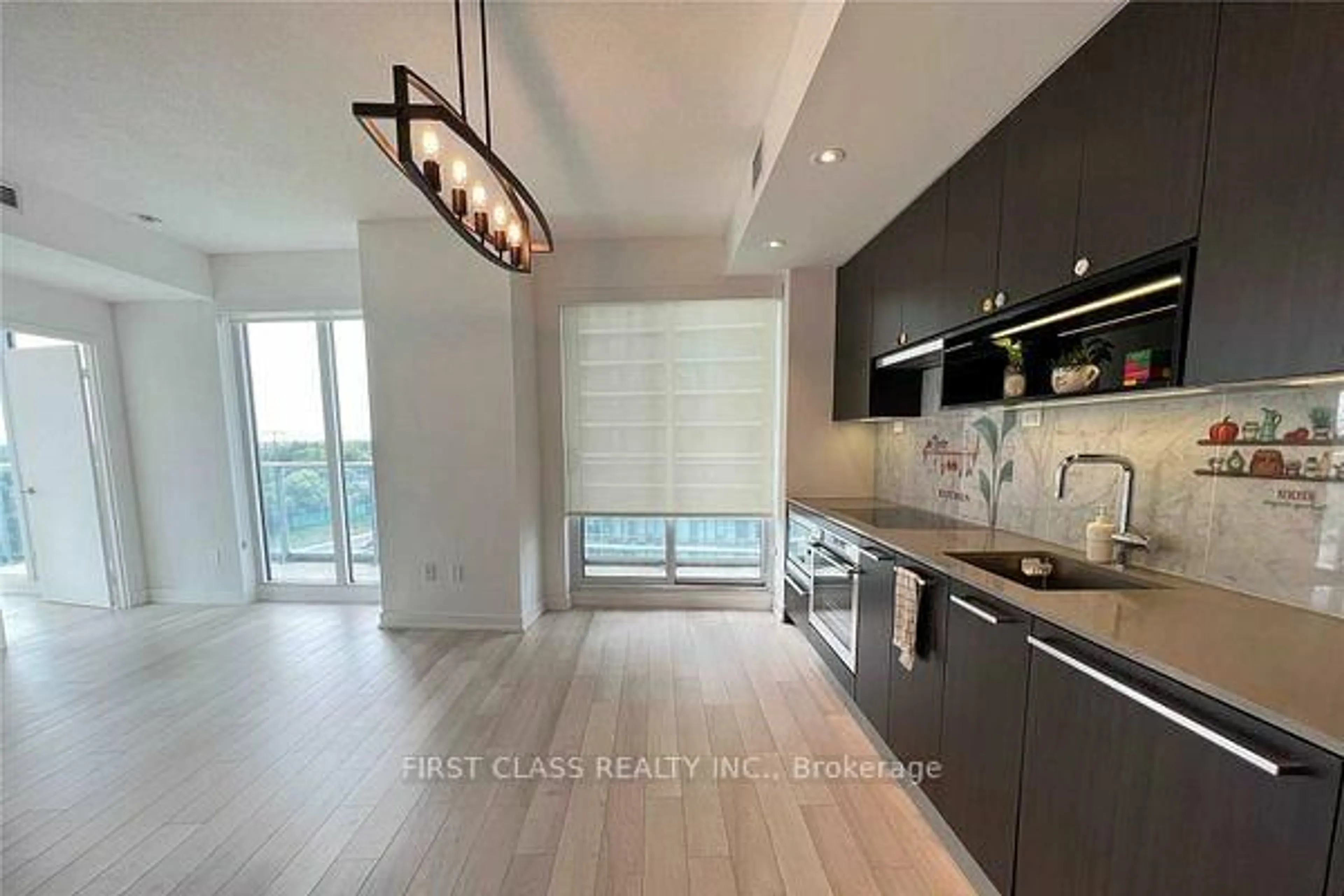 Open concept kitchen, wood/laminate floor for 117 McMahon Dr #303, Toronto Ontario M2K 0E4