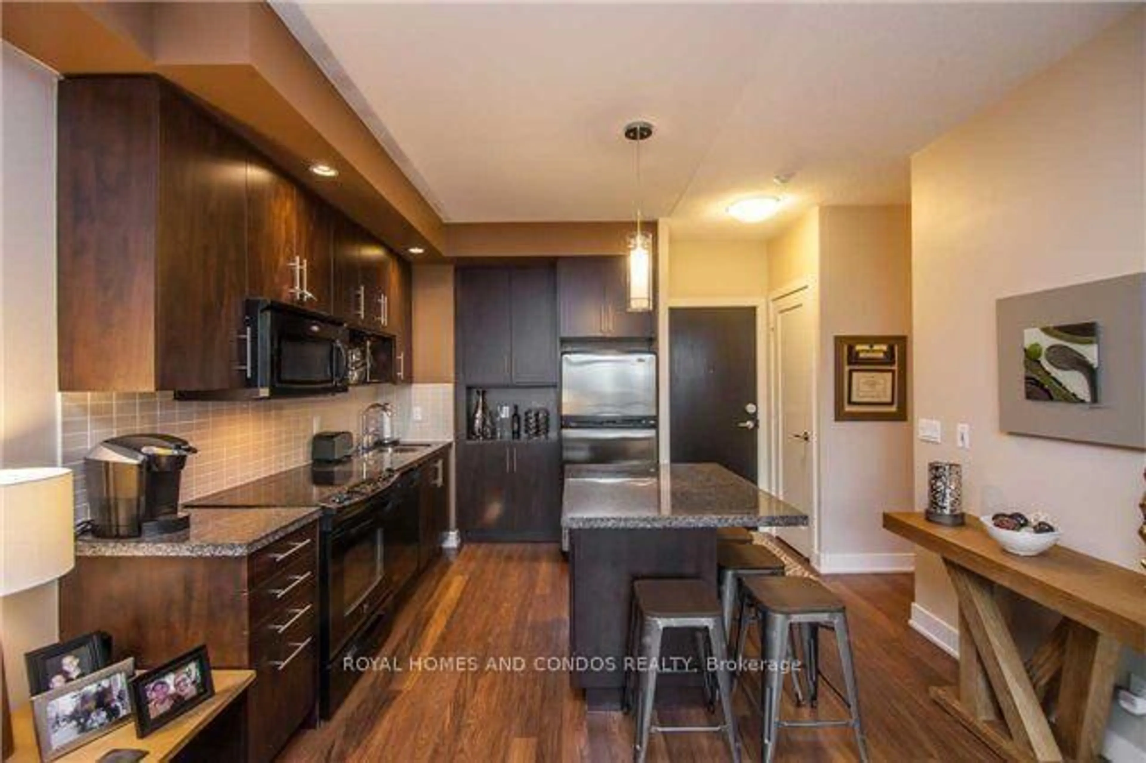 Open concept kitchen, wood/laminate floor for 120 Homewood Ave #610, Toronto Ontario M4Y 1J4
