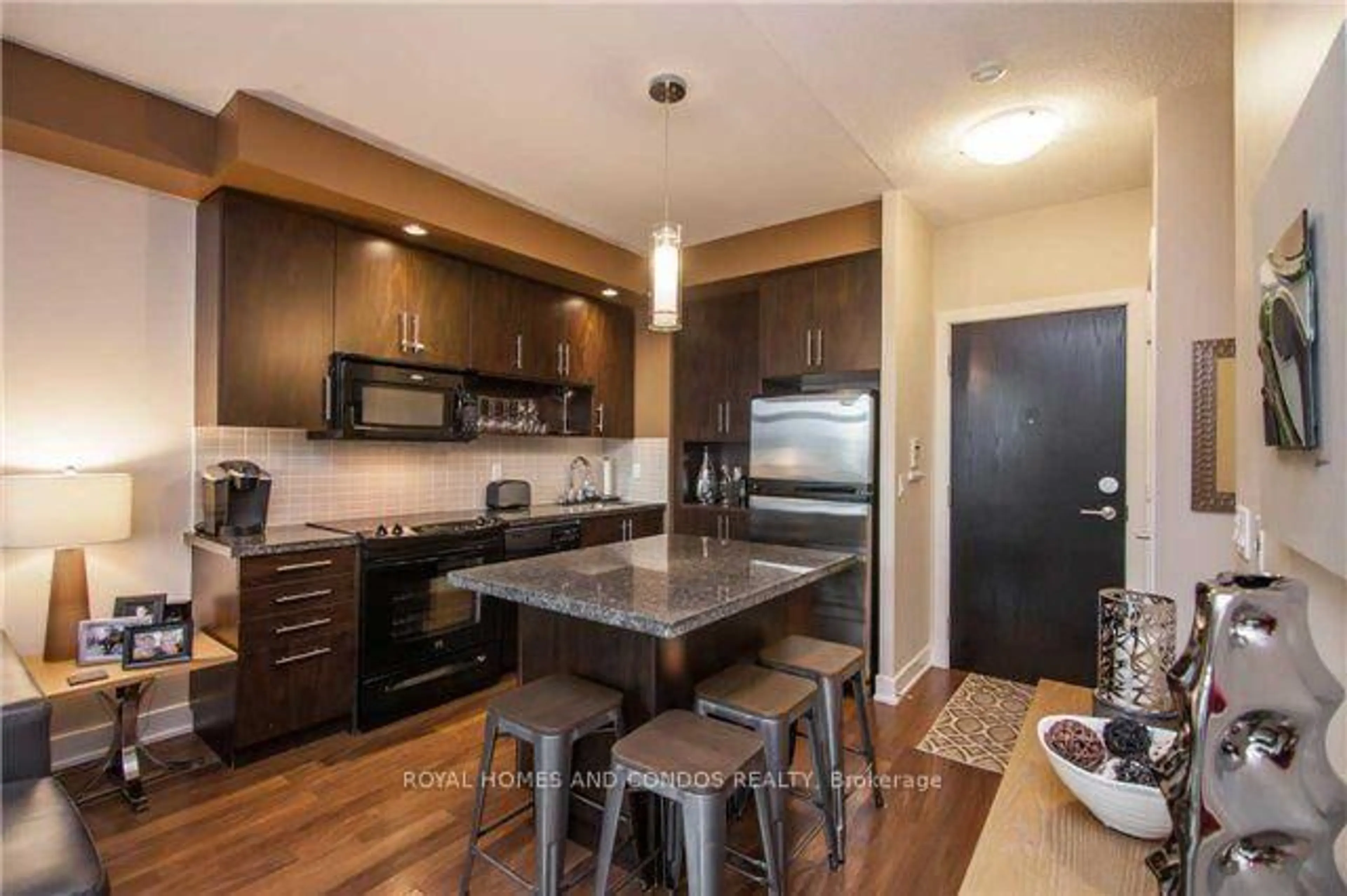 Open concept kitchen, wood/laminate floor for 120 Homewood Ave #610, Toronto Ontario M4Y 1J4