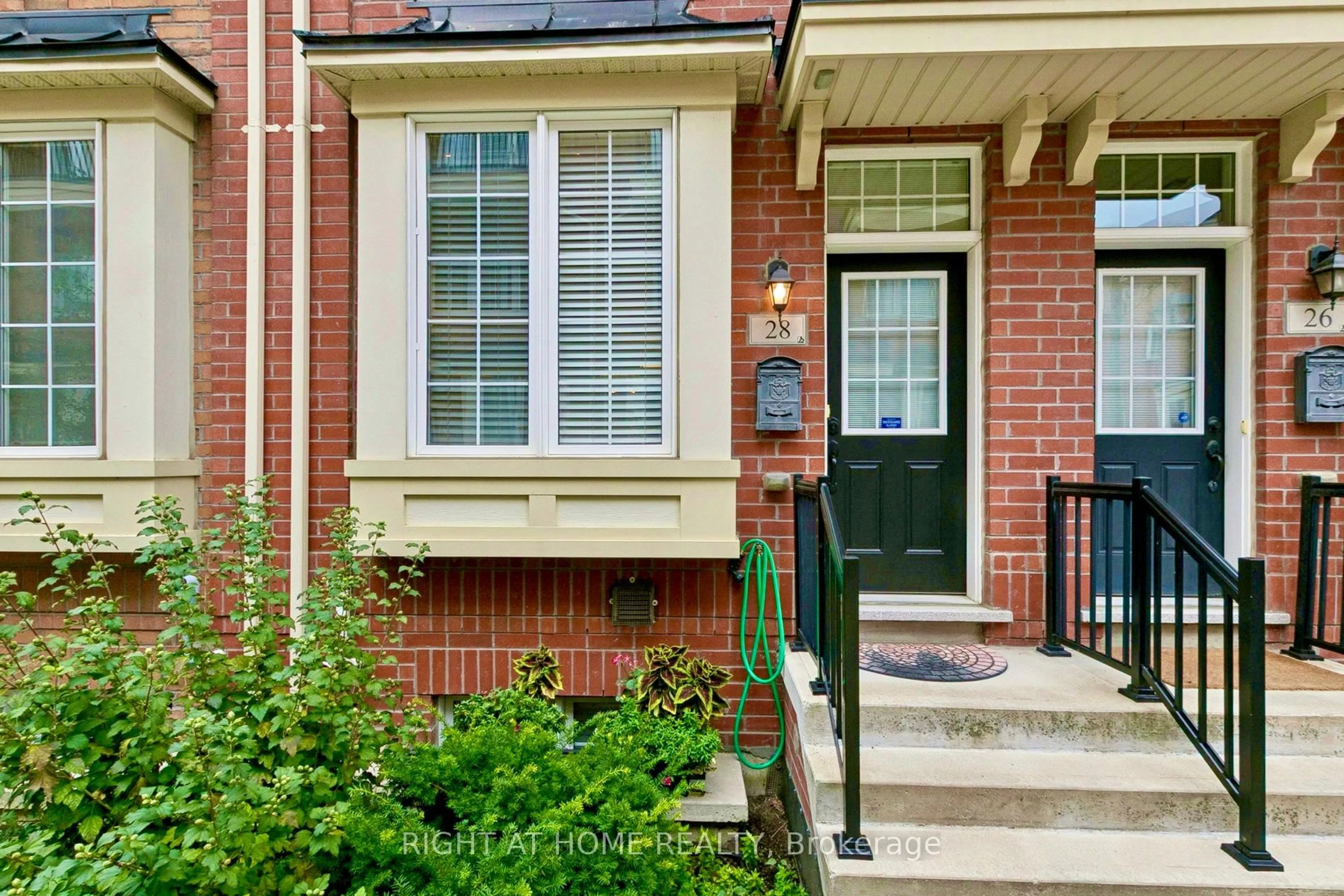 Home with brick exterior material, street for 28 Raffeix Lane, Toronto Ontario M5A 0G5