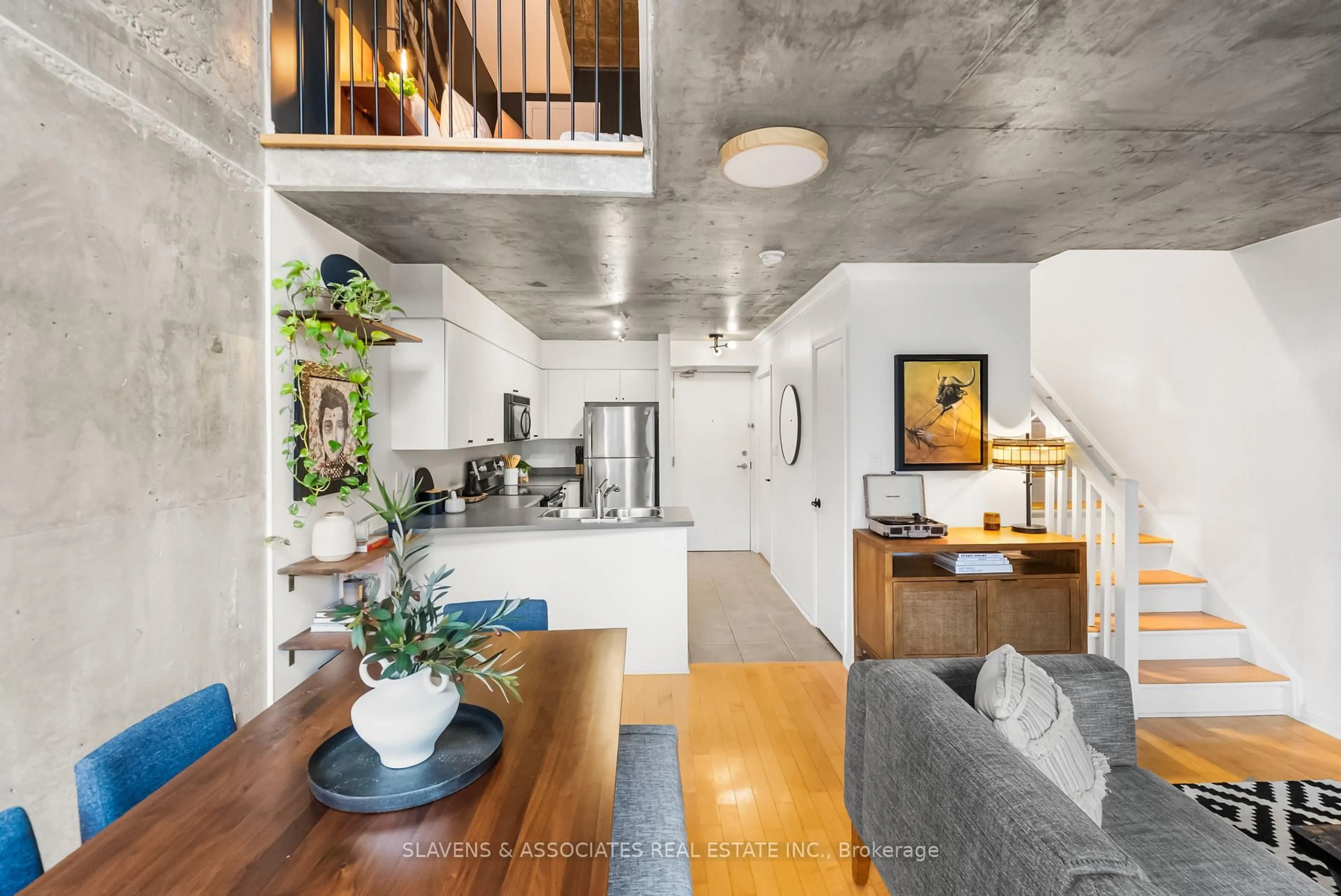 Open concept kitchen, cement floor for 1029 King St #805, Toronto Ontario M6K 3M9