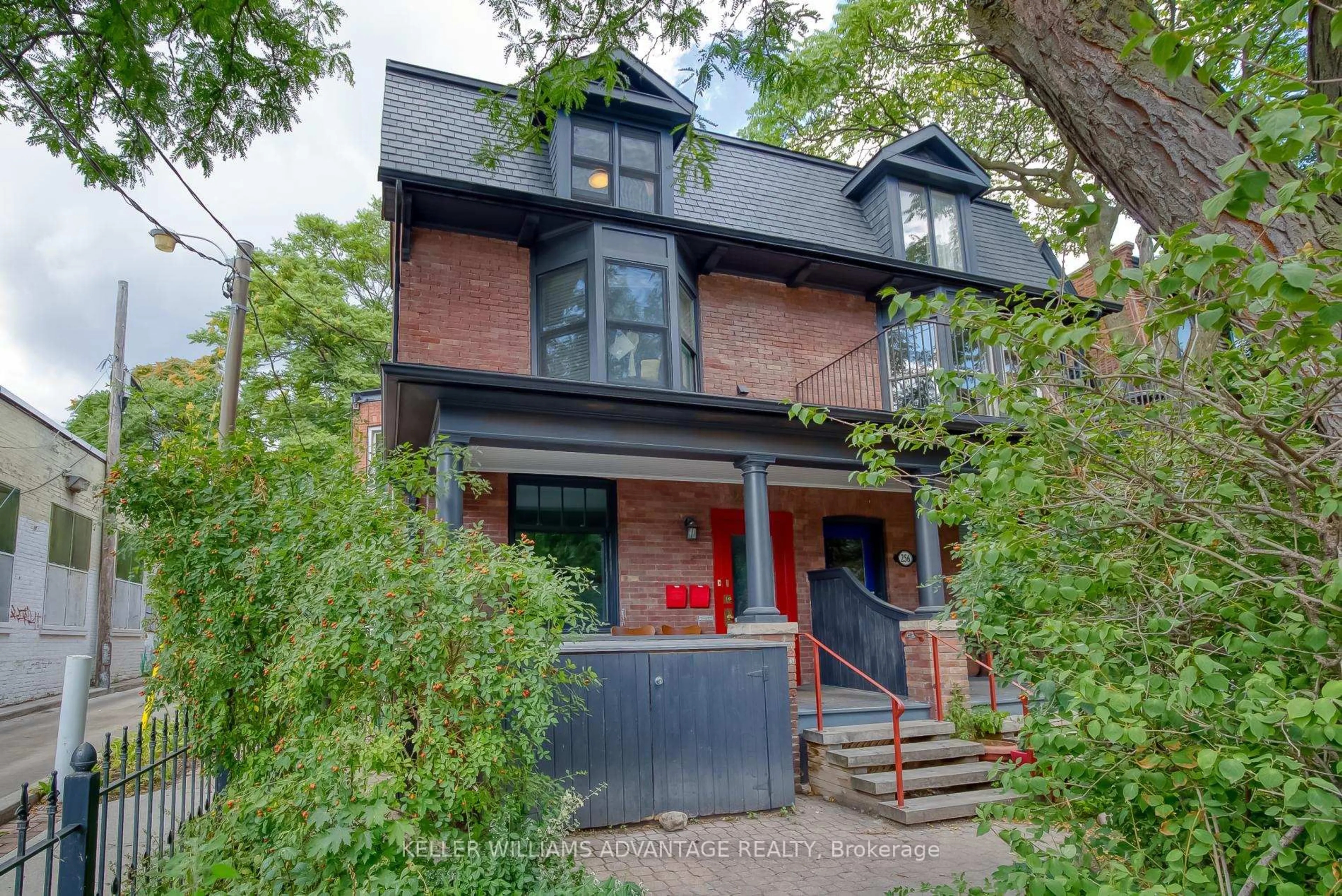 Home with brick exterior material, street for 254A Carlton St, Toronto Ontario M5A 2L3