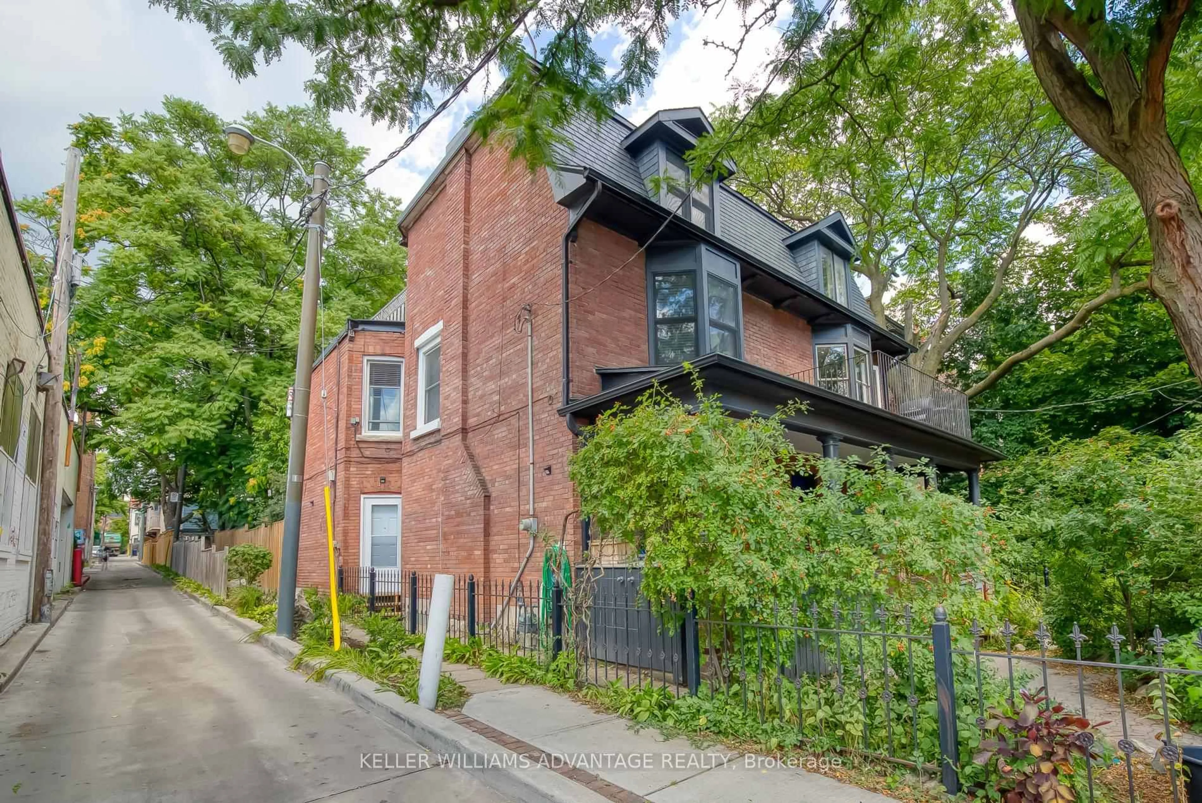 Home with brick exterior material, street for 254A Carlton St, Toronto Ontario M5A 2L3