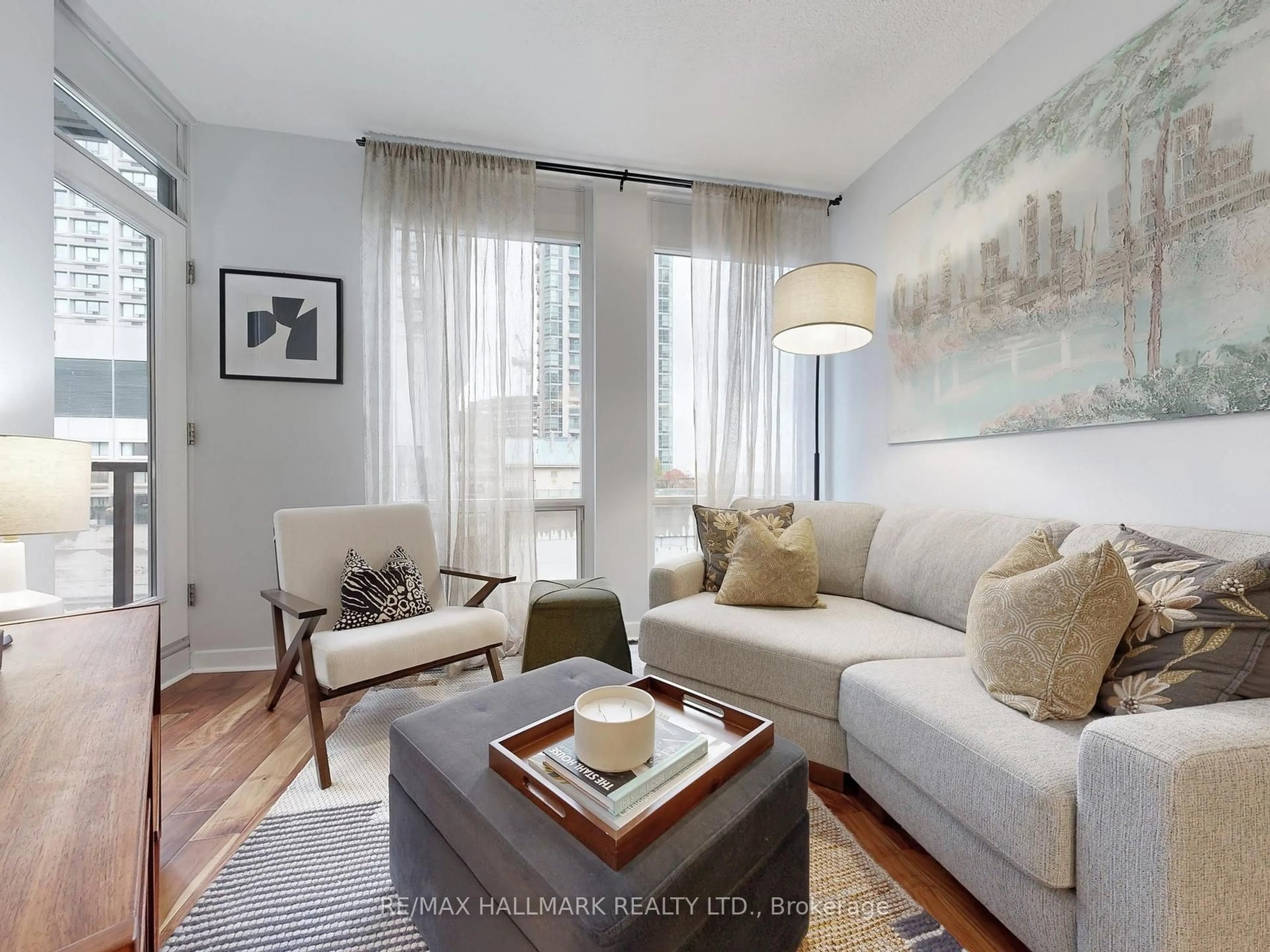 Living room with furniture, wood/laminate floor for 85 Bloor St #1403, Toronto Ontario M4W 3Y1