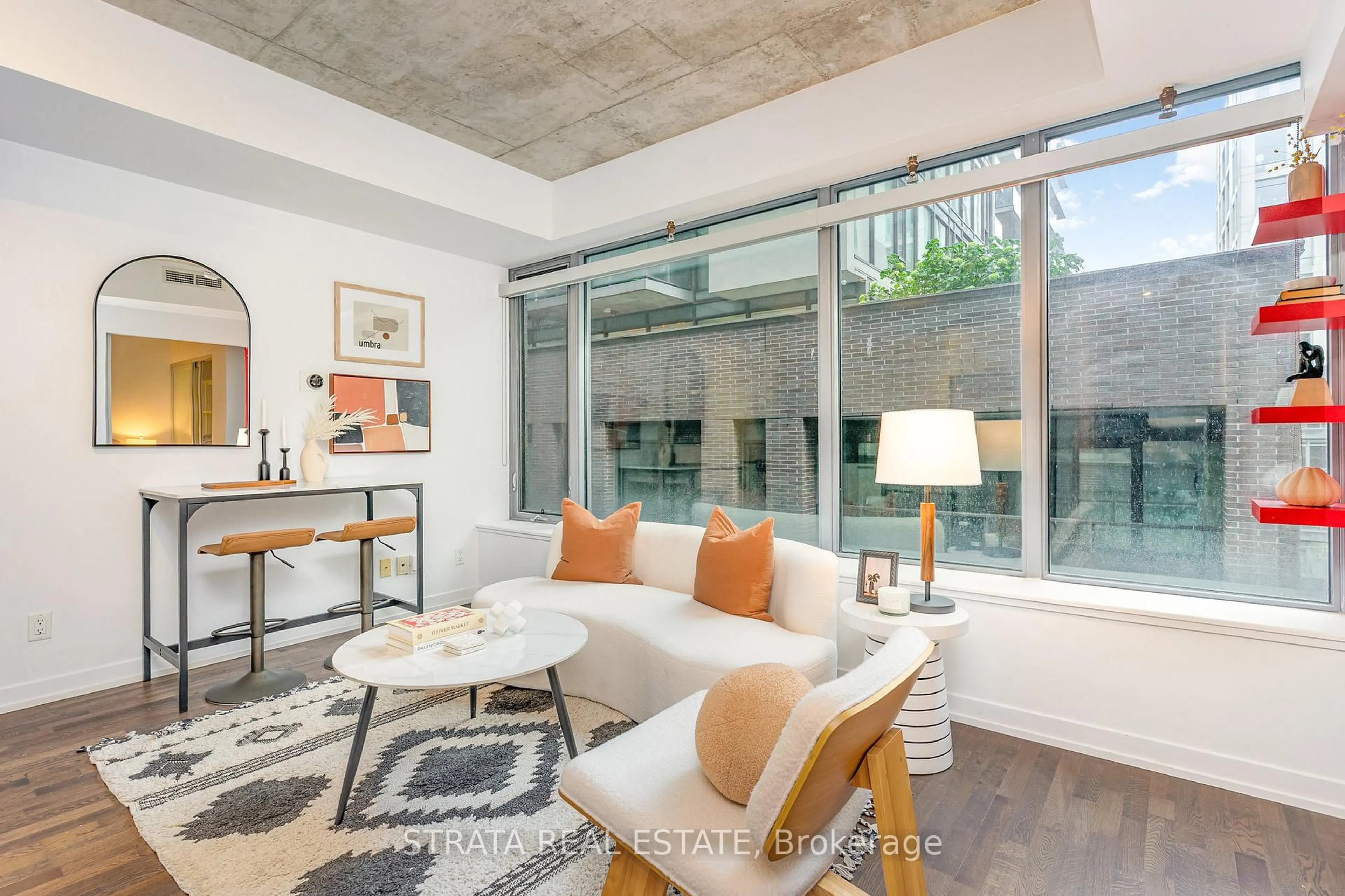 Living room with furniture, cement floor for 95 Bathurst St #615, Toronto Ontario M5V 2P9