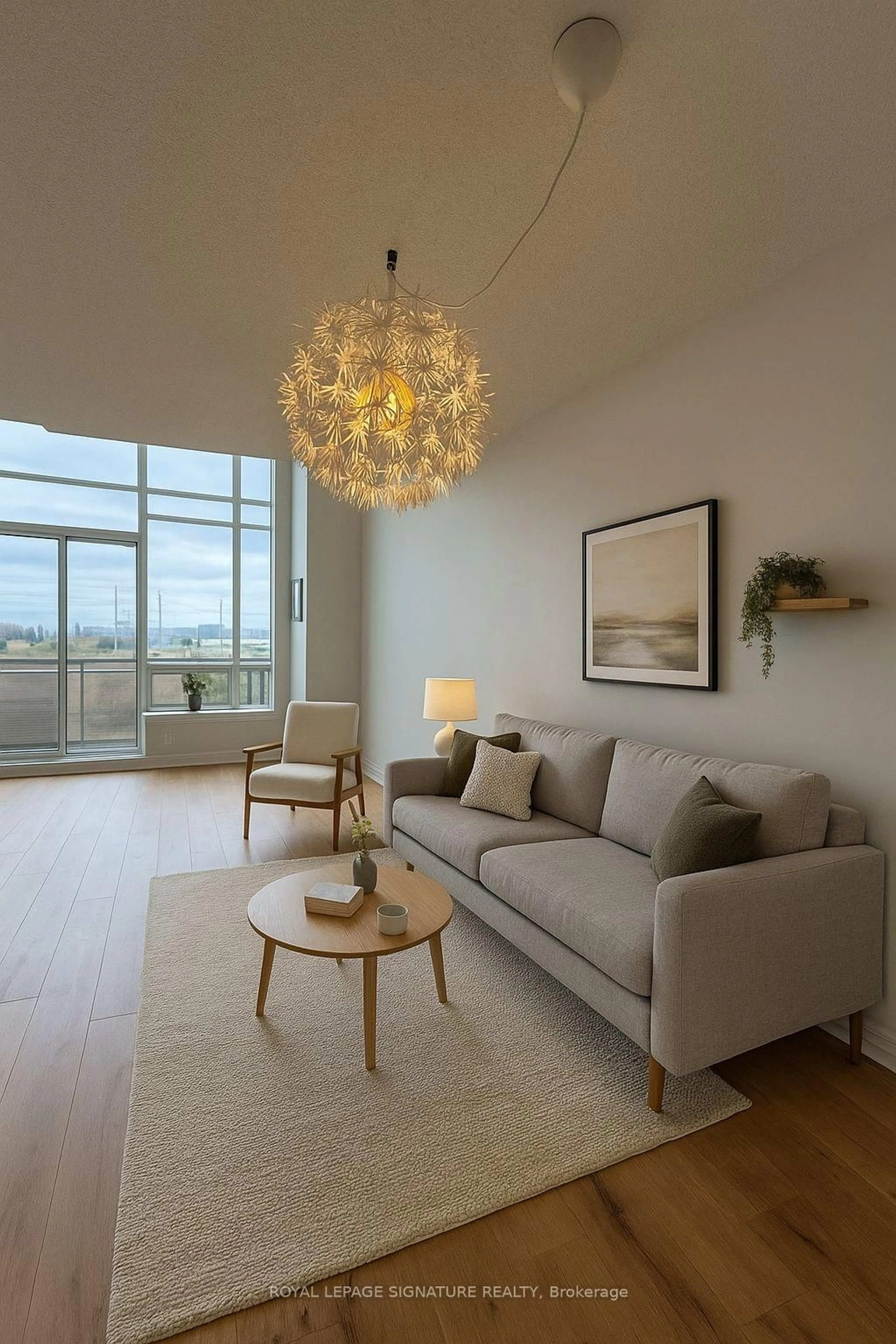 Living room with furniture, wood/laminate floor for 1720 Eglinton Ave #812, Toronto Ontario M4A 2X8