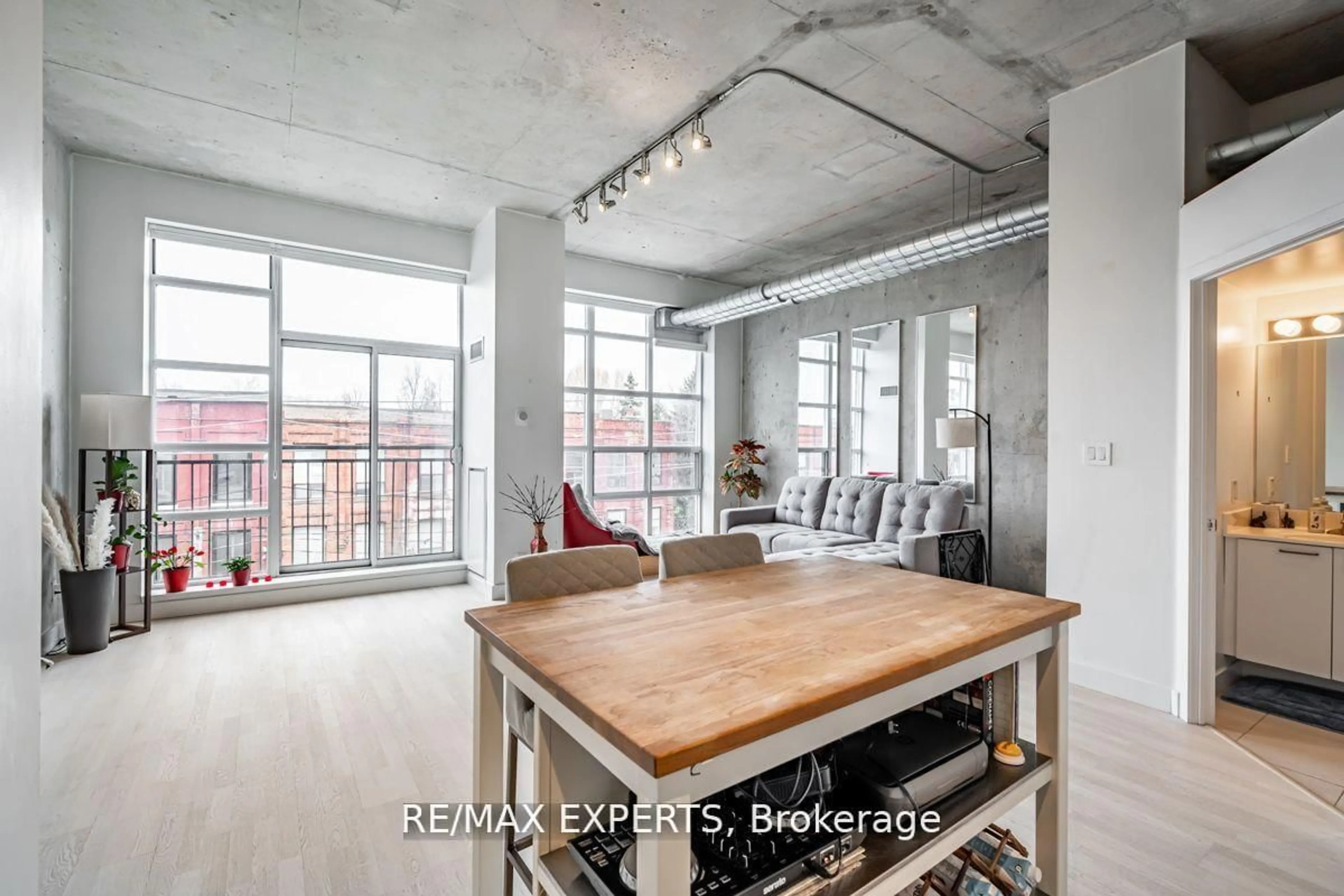 Open concept kitchen, cement floor for 955 QUEEN St #411, Toronto Ontario M6J 1G9