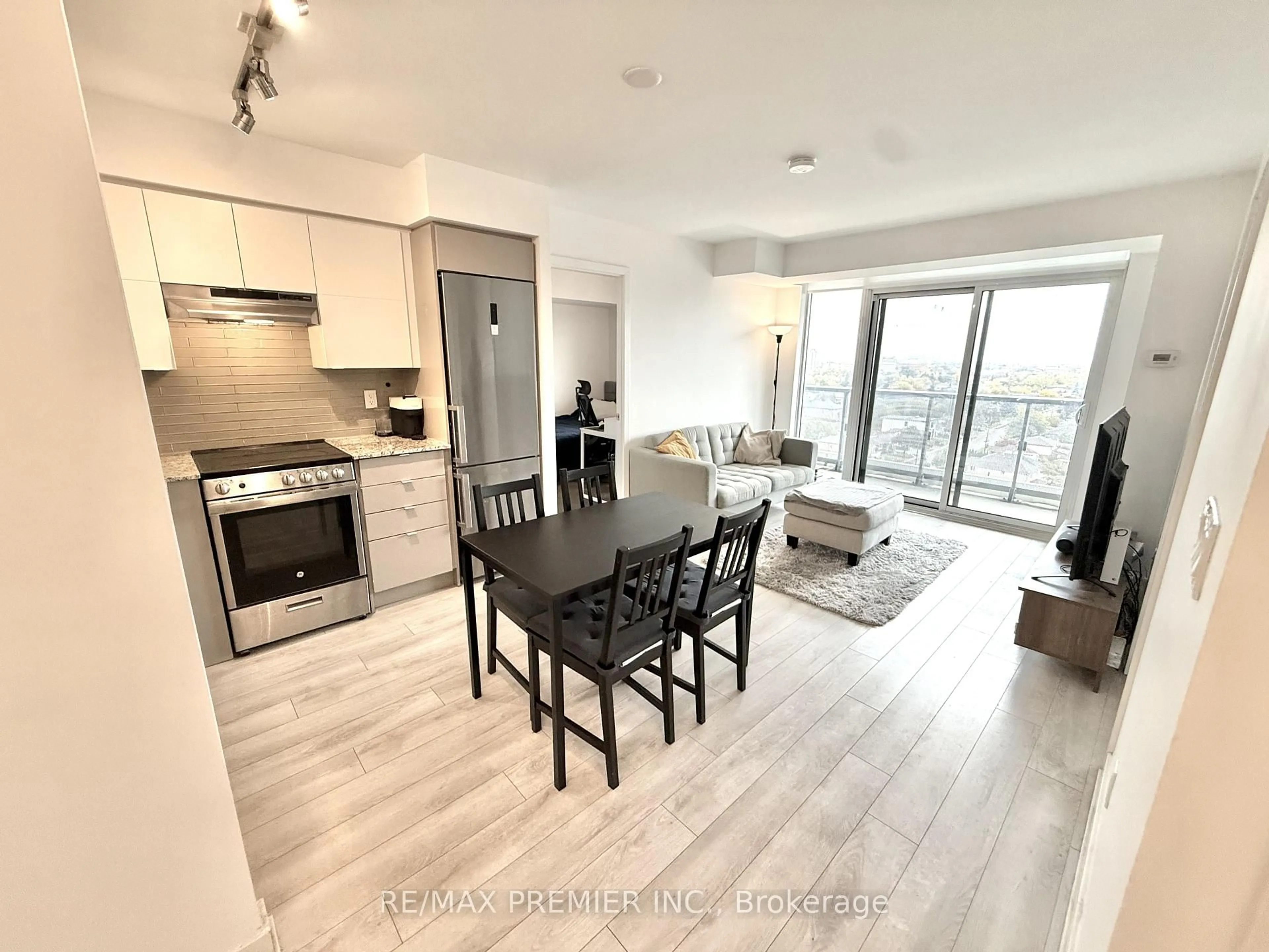 Open concept kitchen, wood/laminate floor for 120 Varna Dr #1413, Toronto Ontario M6A 0B3