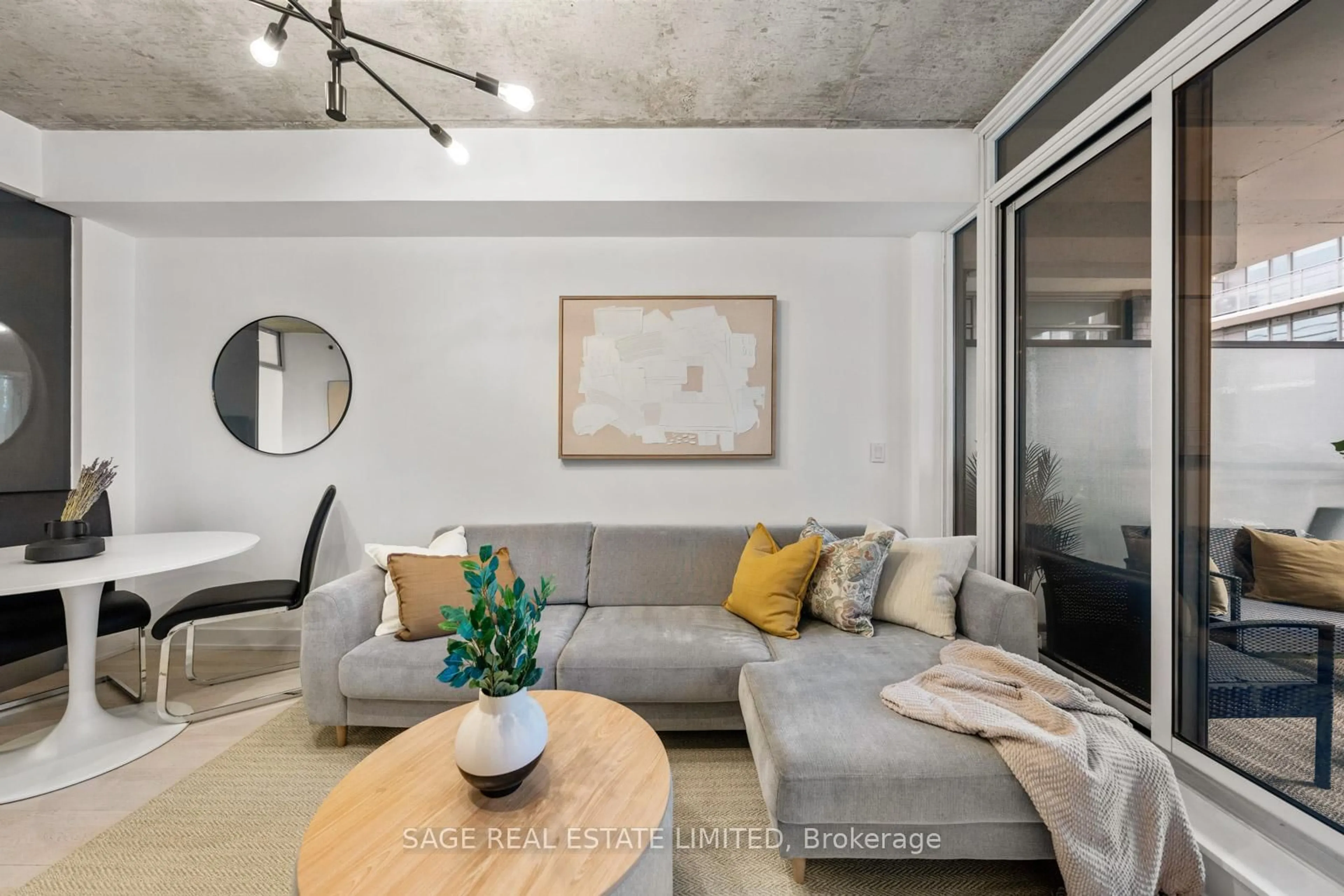 Living room with furniture, cement floor for 20 Gladstone Ave #714, Toronto Ontario M6J 0E9