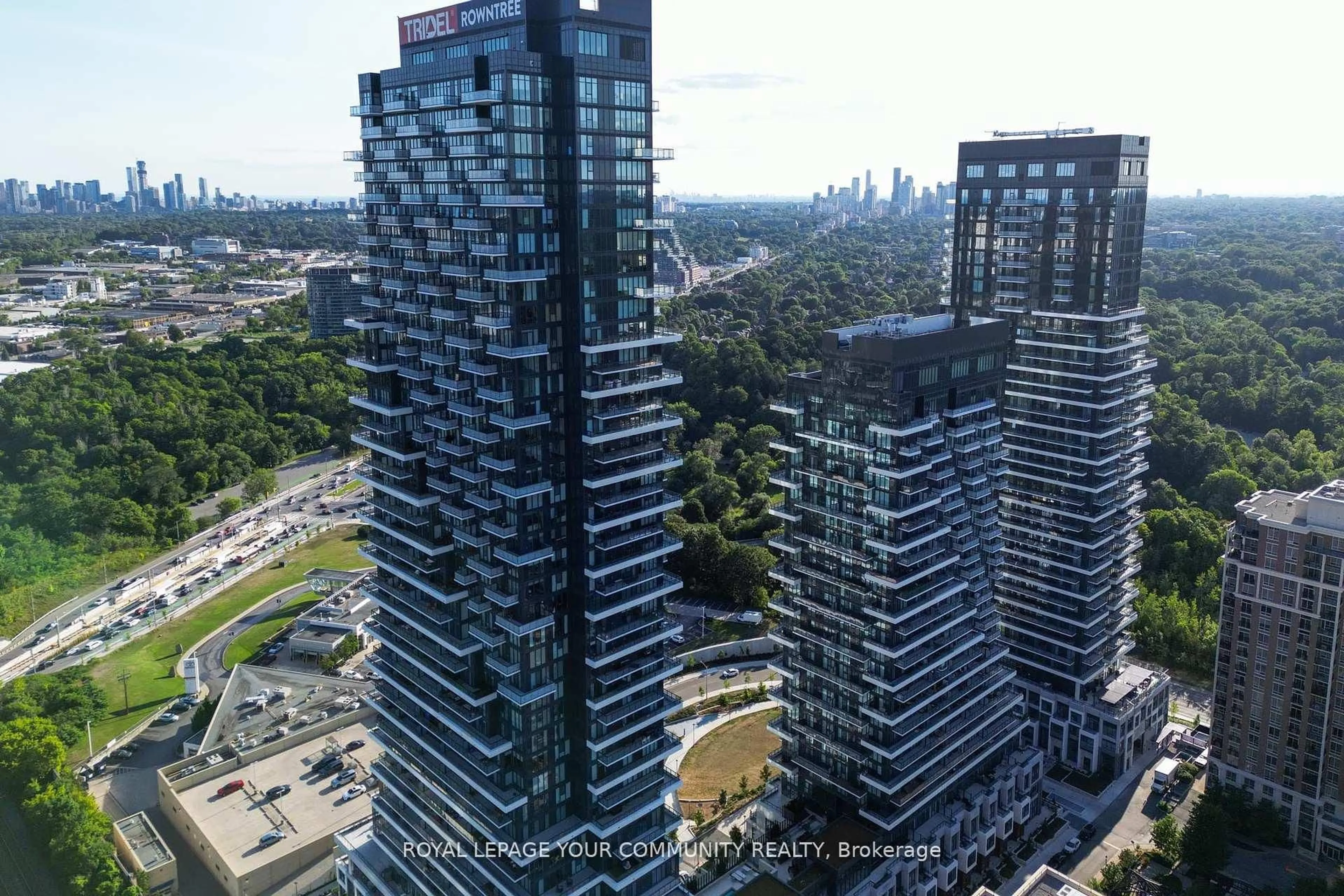 A pic from outside/outdoor area/front of a property/back of a property/a pic from drone, city buildings view from balcony for 10 Inn on the Park Dr #101, Toronto Ontario M3C 0P9