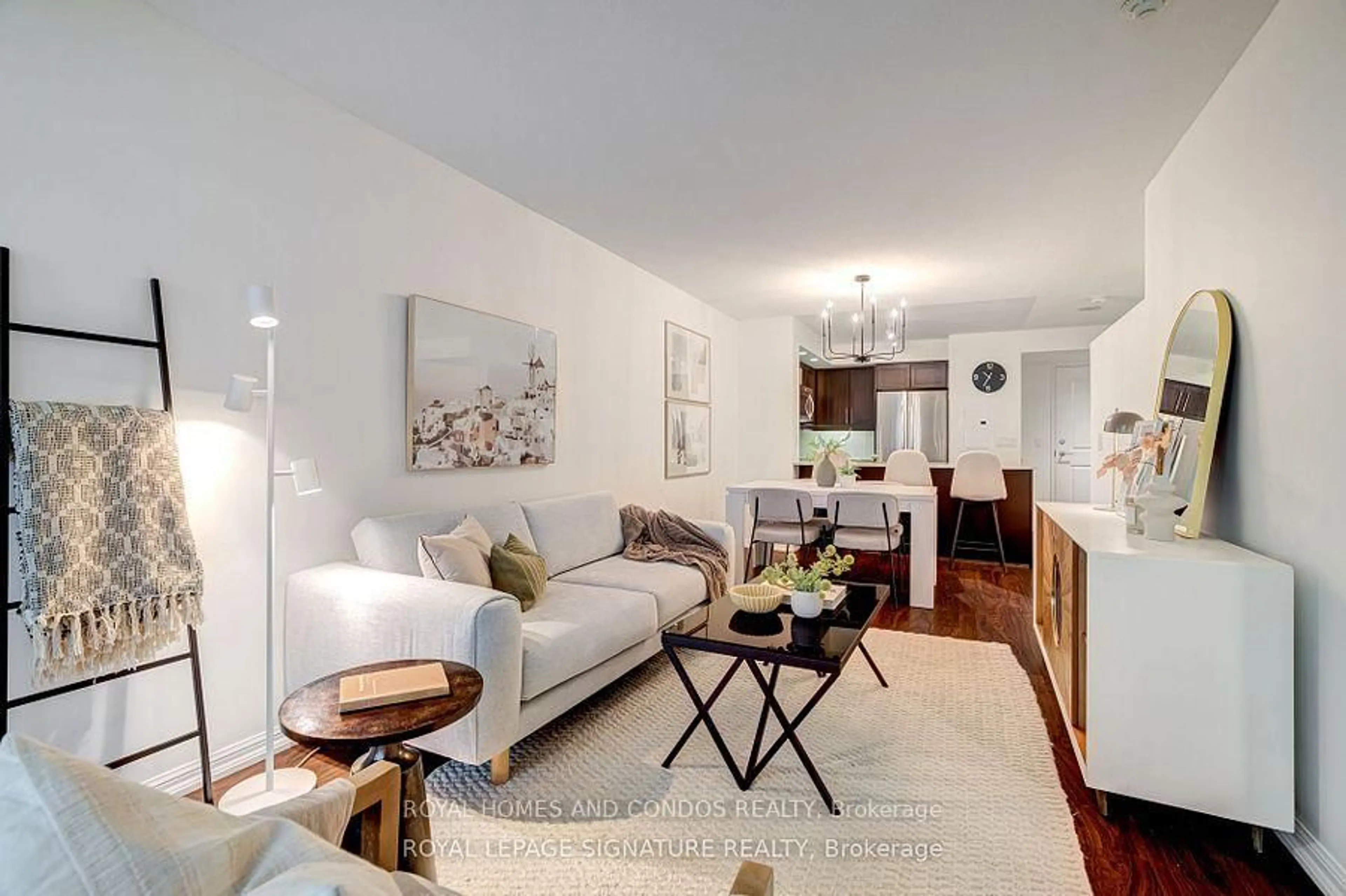 Living room with furniture, wood/laminate floor for 85 East Liberty St #713, Toronto Ontario M6K 3R4