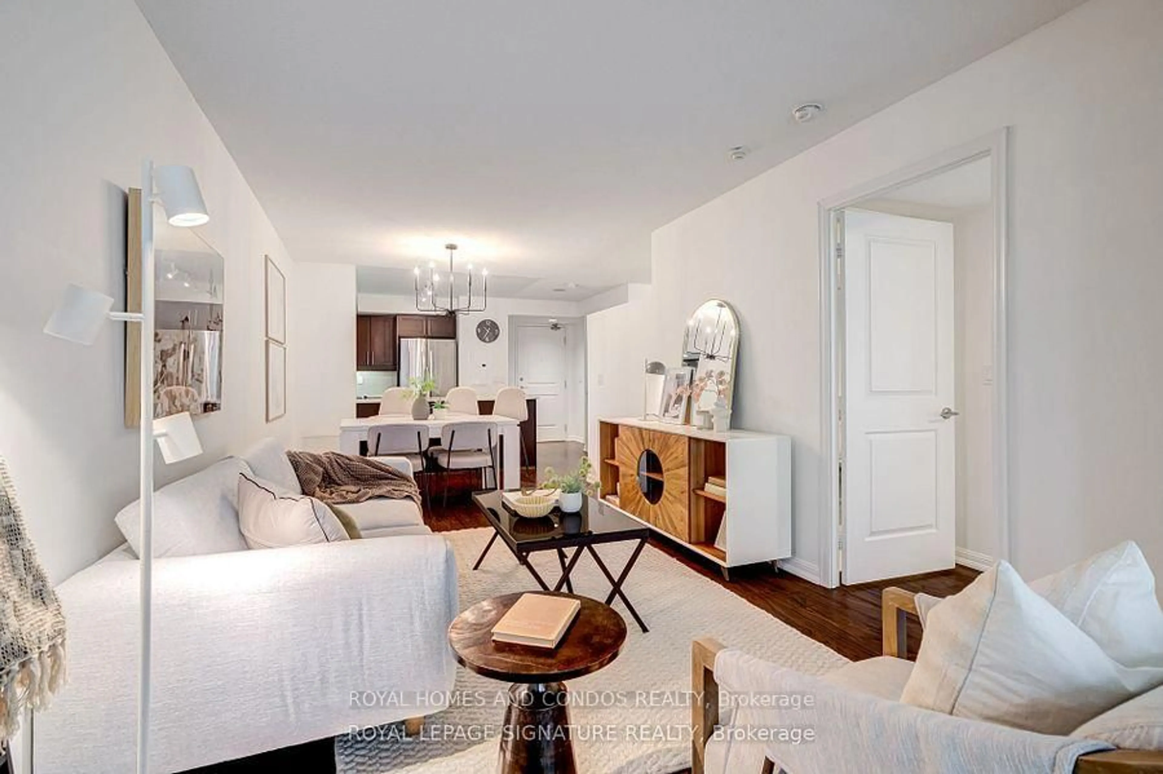 Living room with furniture, wood/laminate floor for 85 East Liberty St #713, Toronto Ontario M6K 3R4