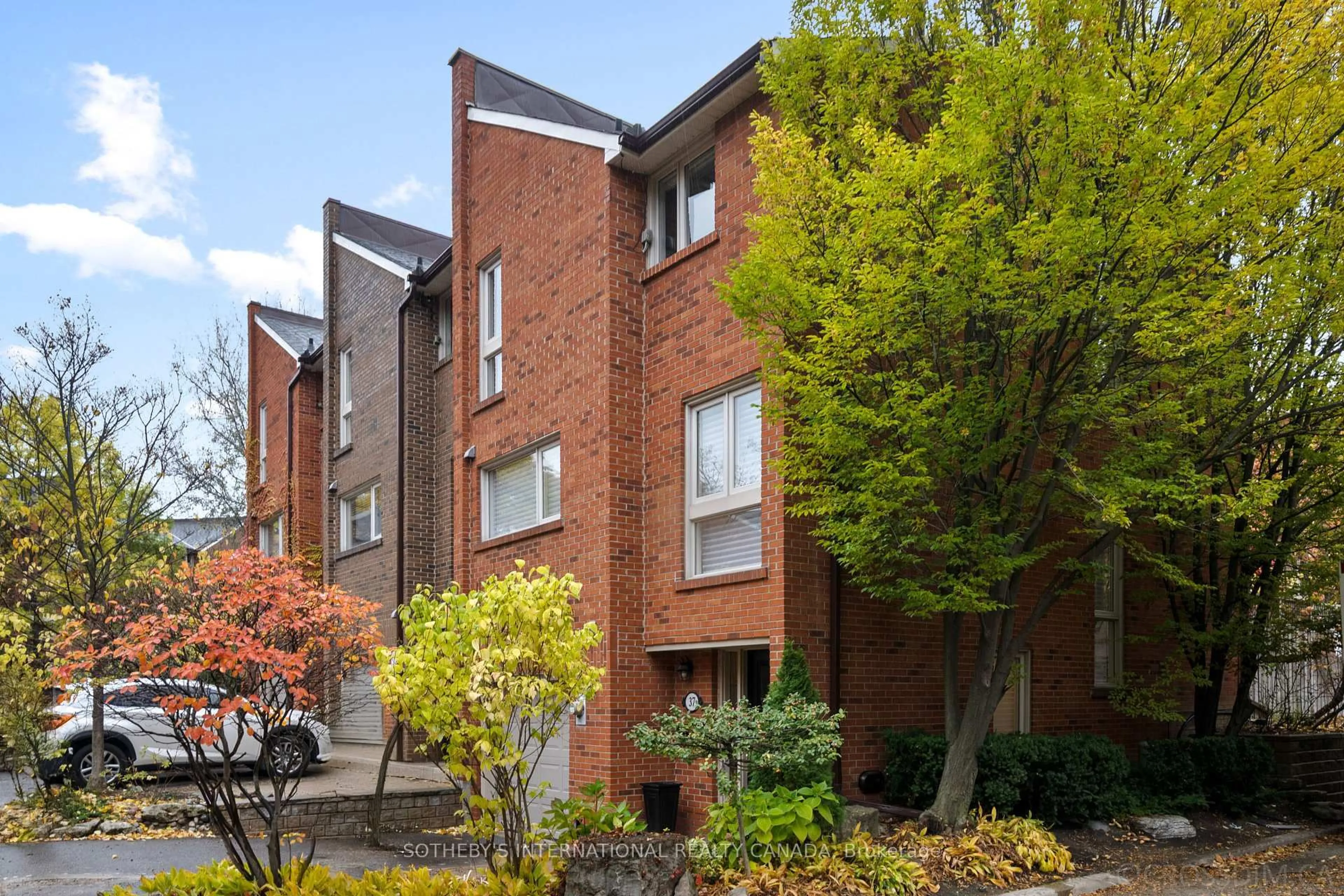 Home with brick exterior material, street for 37 Sylvan Valleyway, Toronto Ontario M5M 4M4