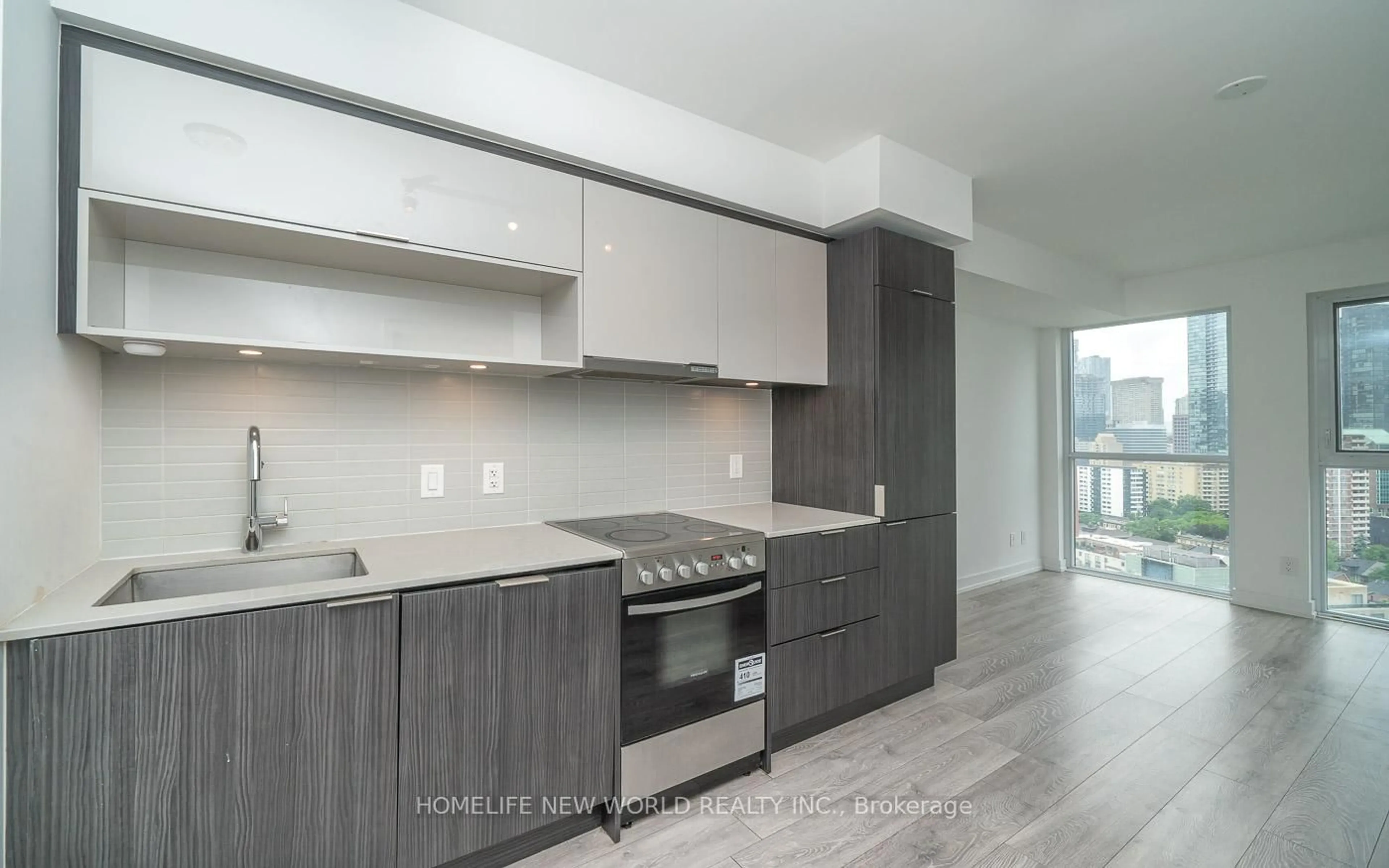 Open concept kitchen, wood/laminate floor for 159 Wellesley St #1811, Toronto Ontario M4Y 0H5