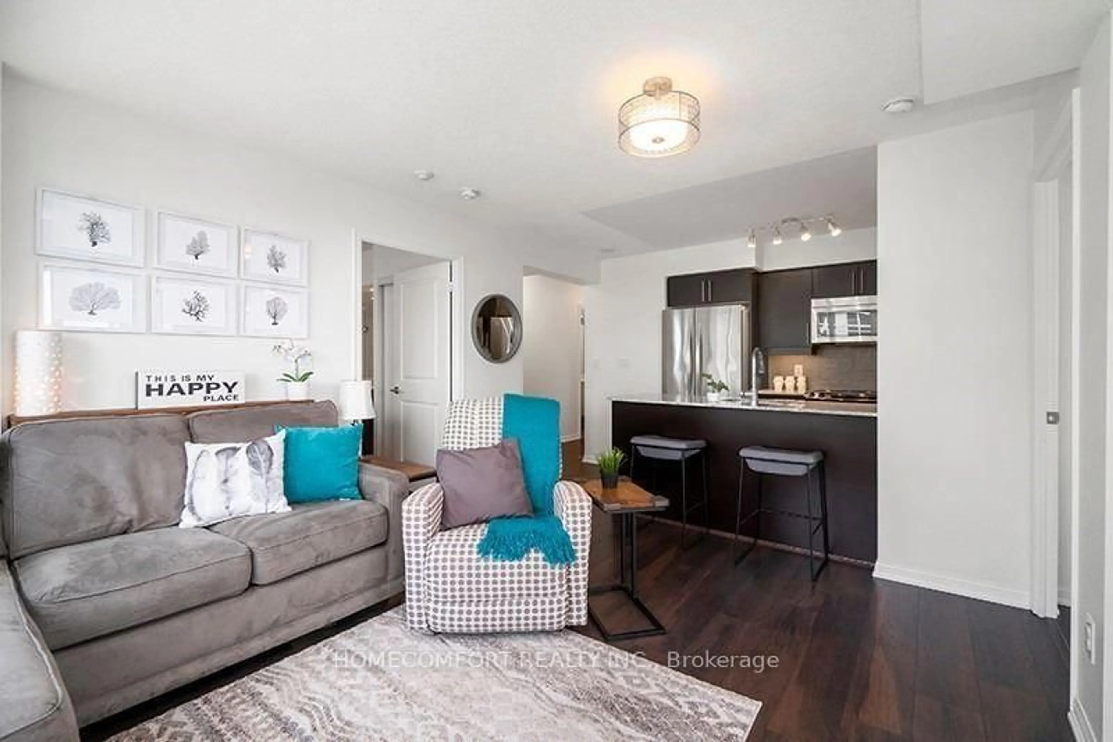 Living room with furniture, wood/laminate floor for 38 Grand Magazine St #2041, Toronto Ontario M5V 0B1