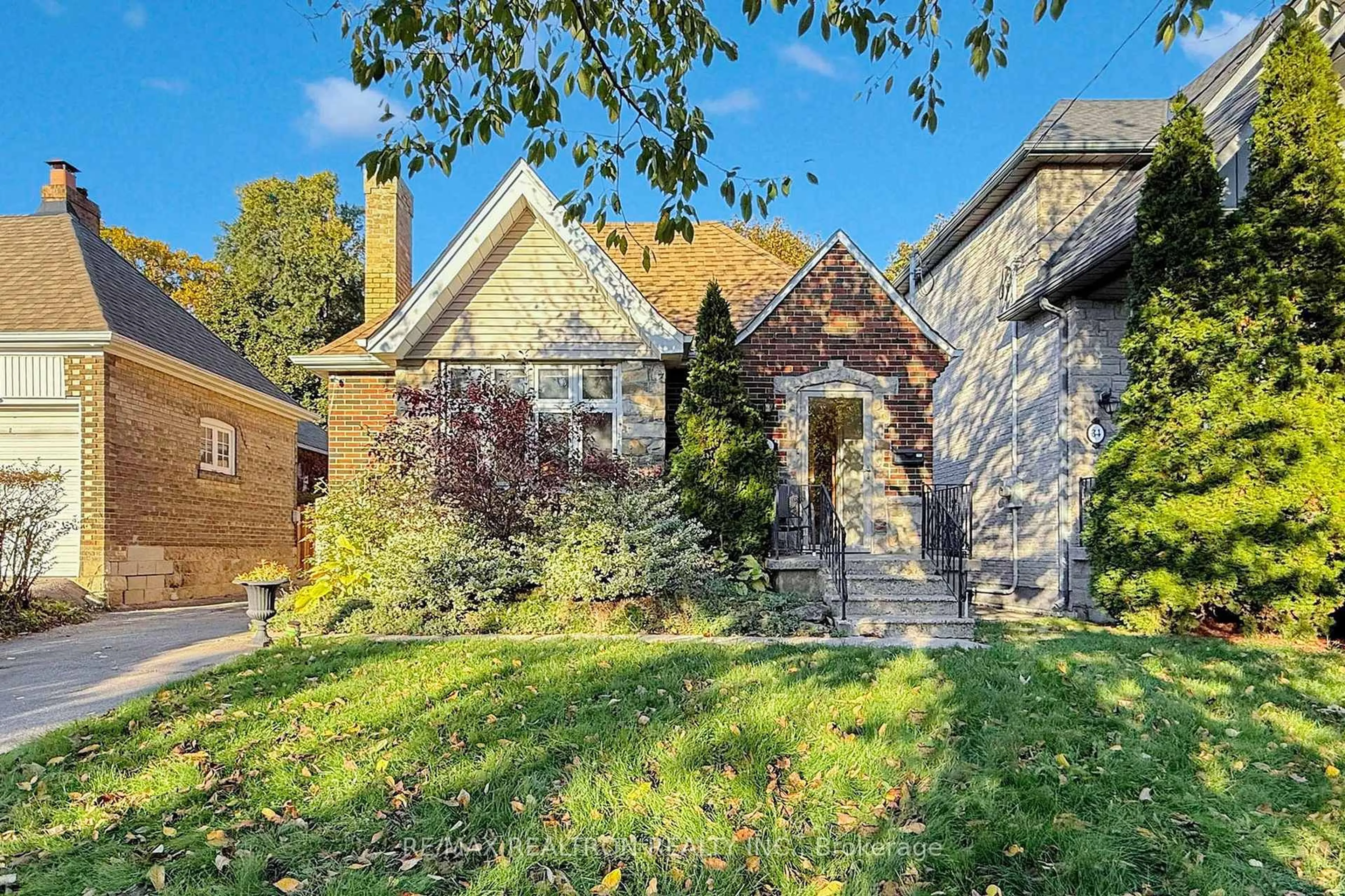 Home with brick exterior material, street for 36 Claxton Blvd, Toronto Ontario M6C 1L8