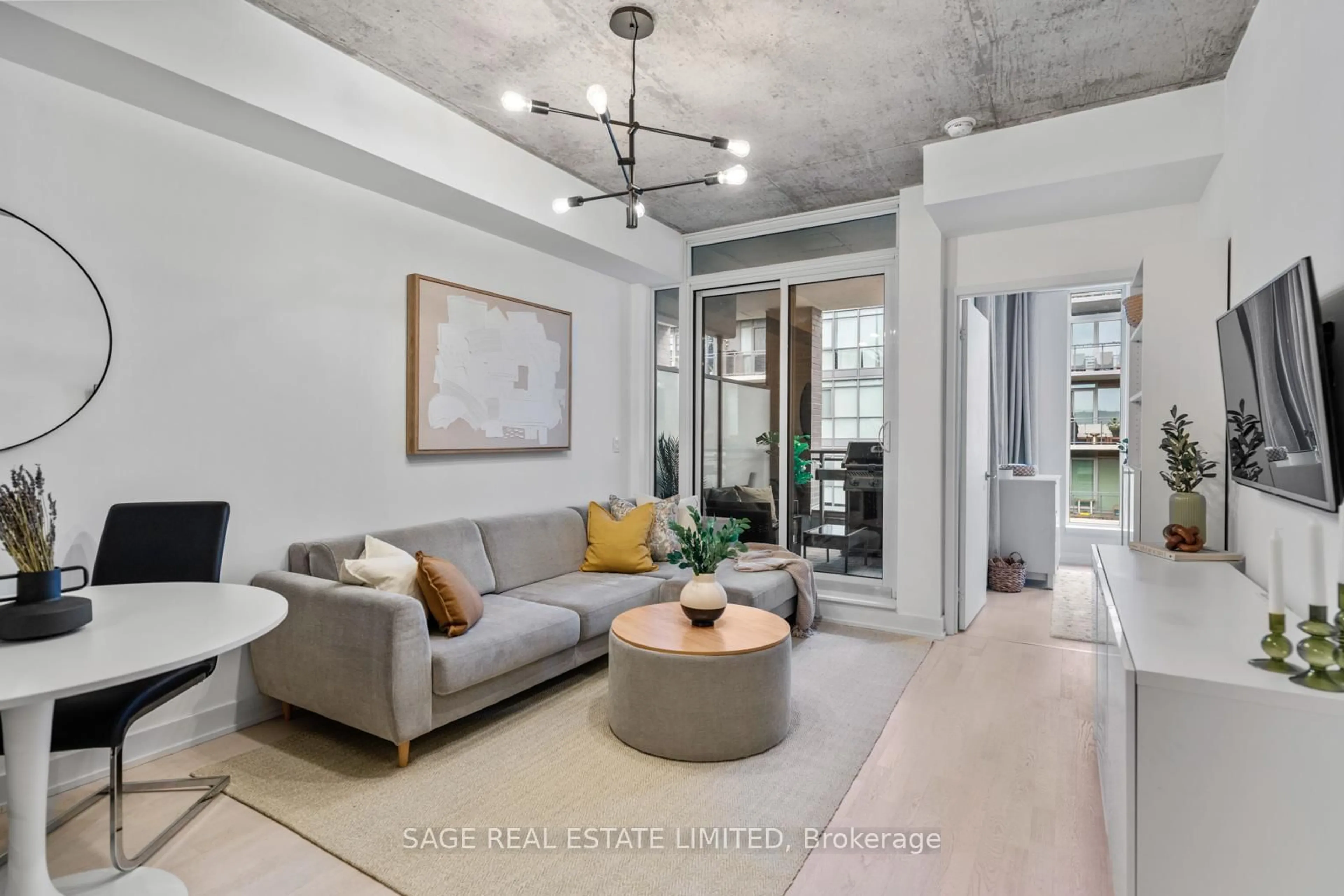 Living room with furniture, cement floor for 20 Gladstone Ave #714, Toronto Ontario M6J 0E9