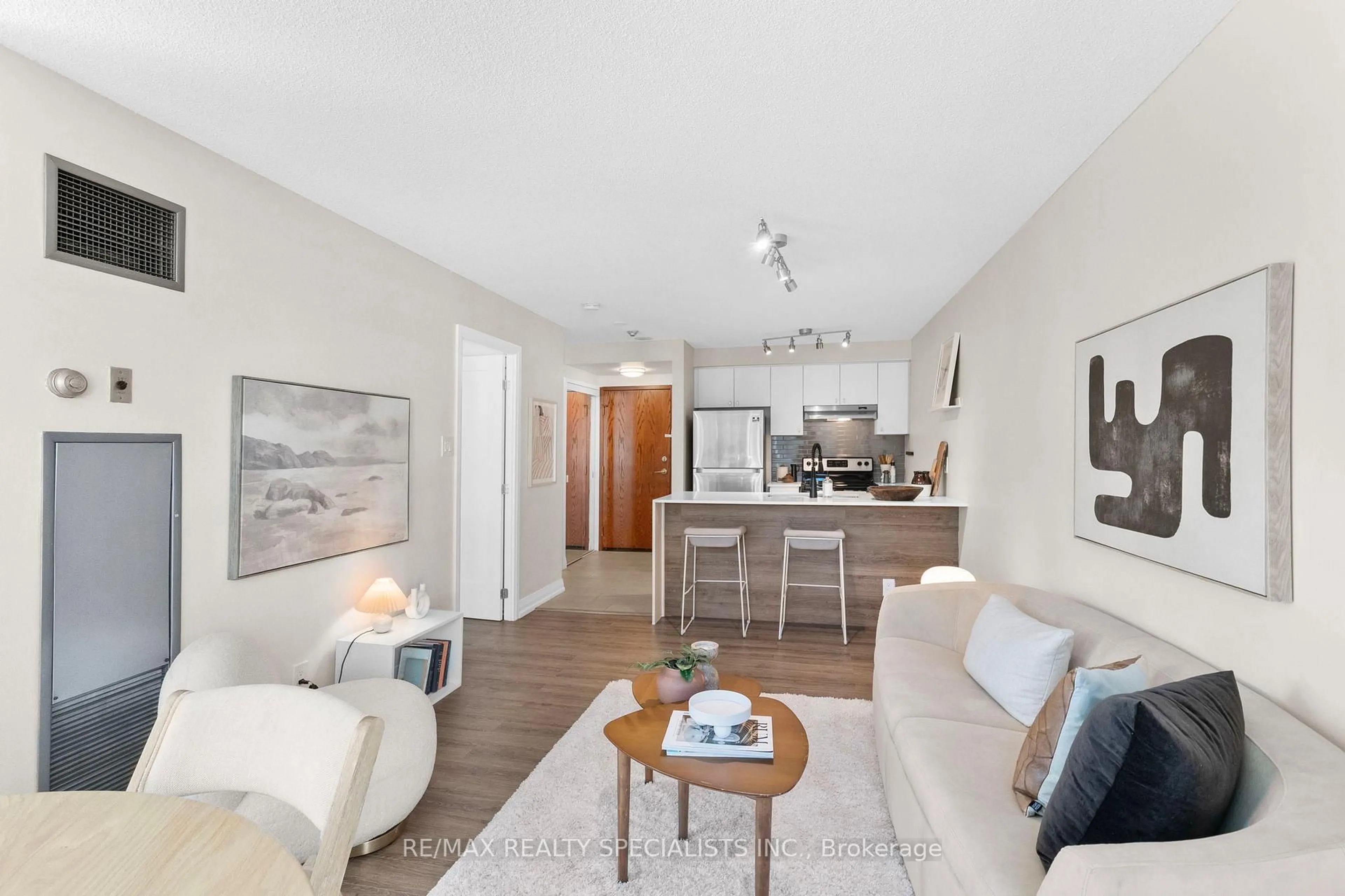 Living room with furniture, wood/laminate floor for 10 Yonge St #710, Toronto Ontario M5E 1R4