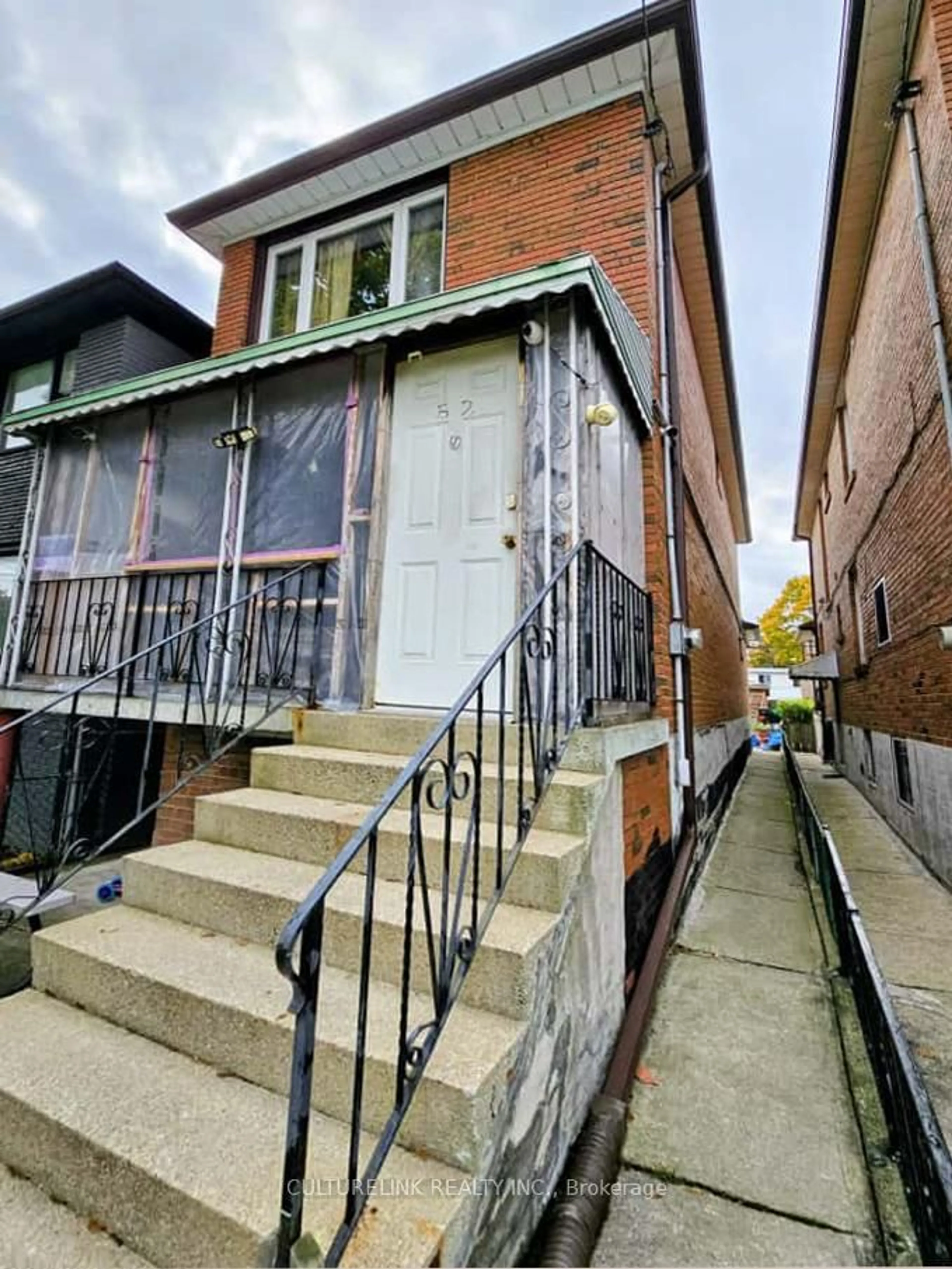 Home with brick exterior material, street for 52 Palmerston Ave, Toronto Ontario M6J 2J1