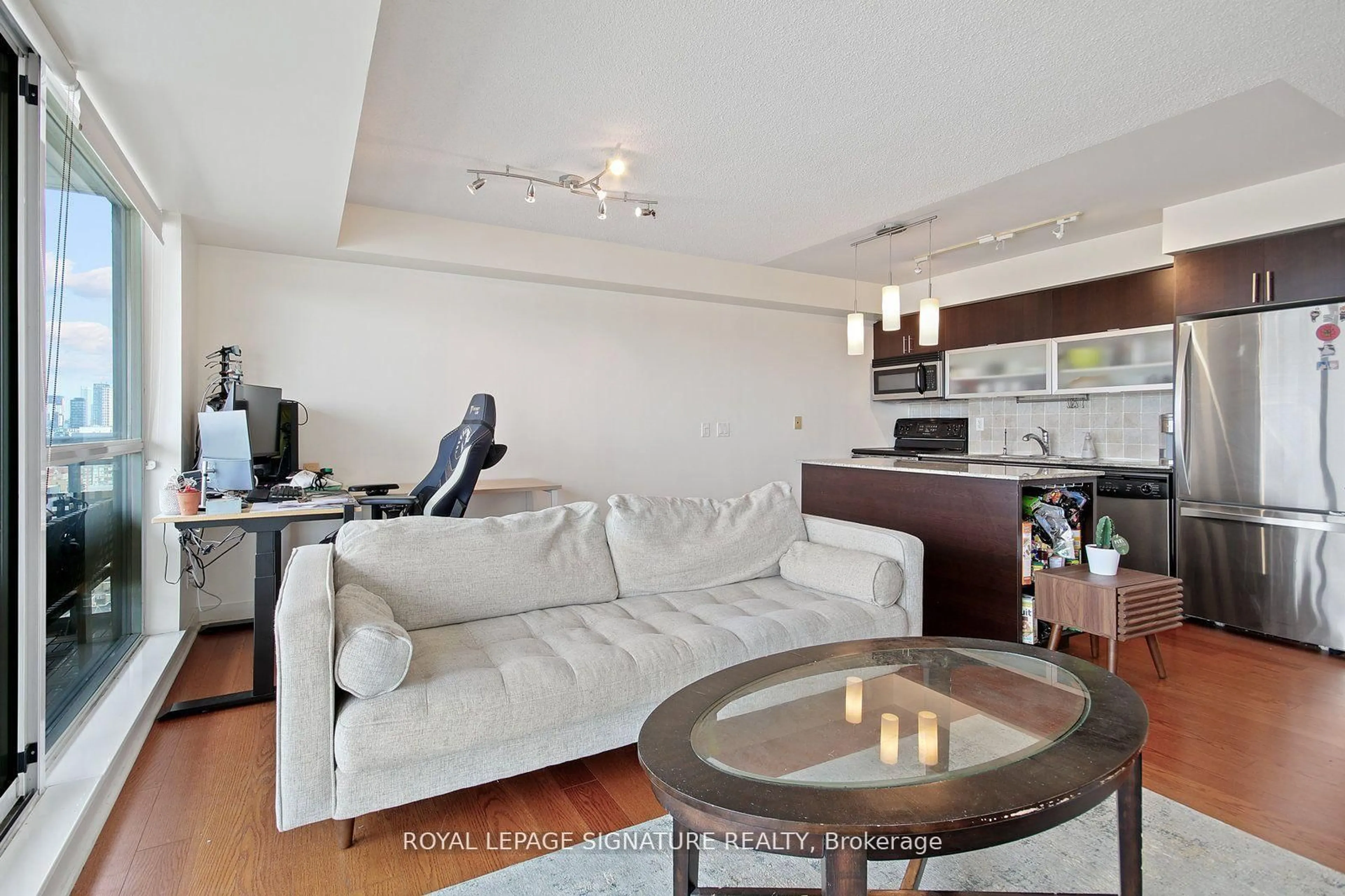 Living room with furniture, wood/laminate floor for 80 Western Battery Rd #2105, Toronto Ontario M6K 3S1
