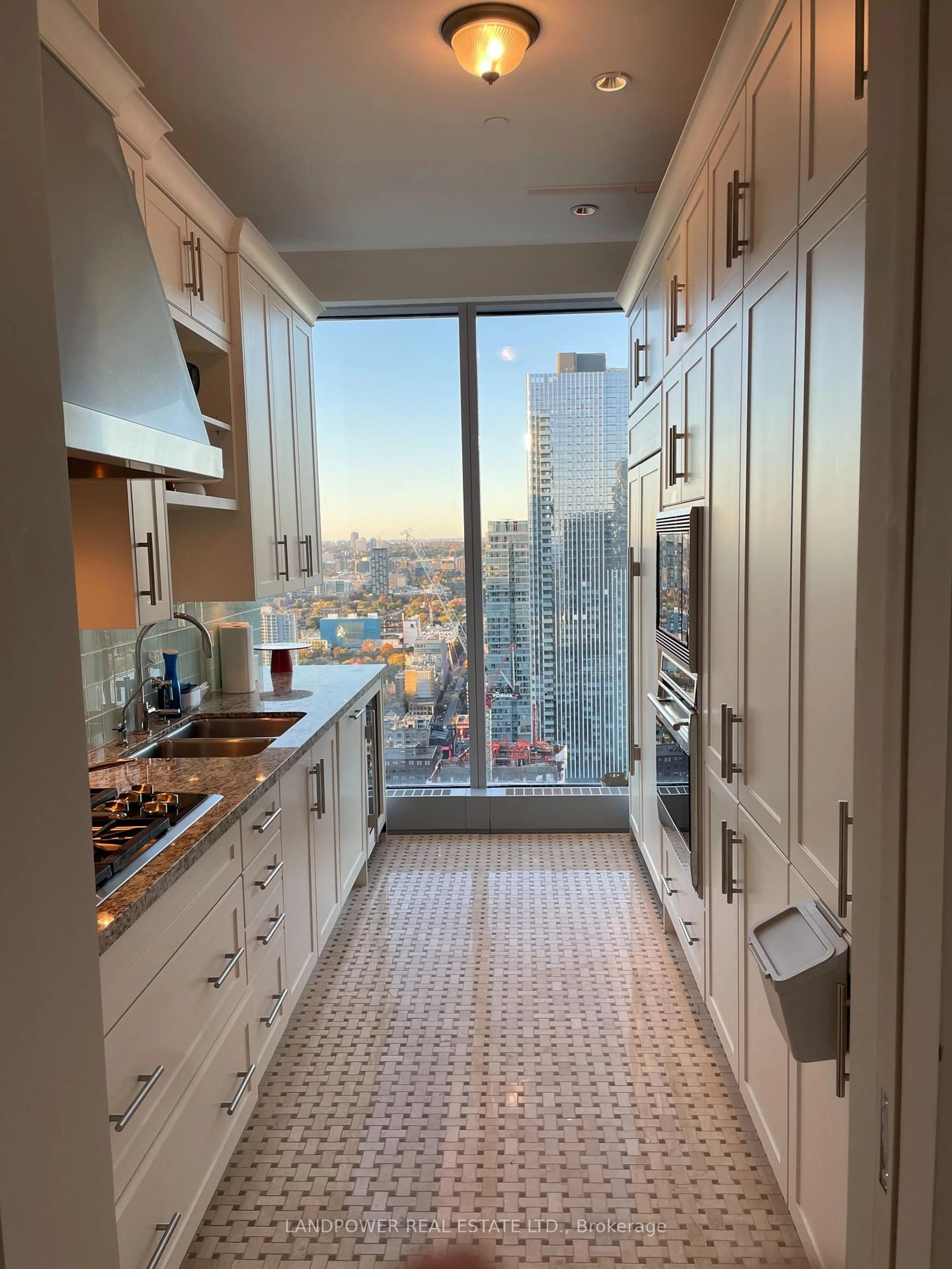 Kitchen with laundary machines, ceramic/tile floor for 183 Wellington St #3702, Toronto Ontario M5V 0A1