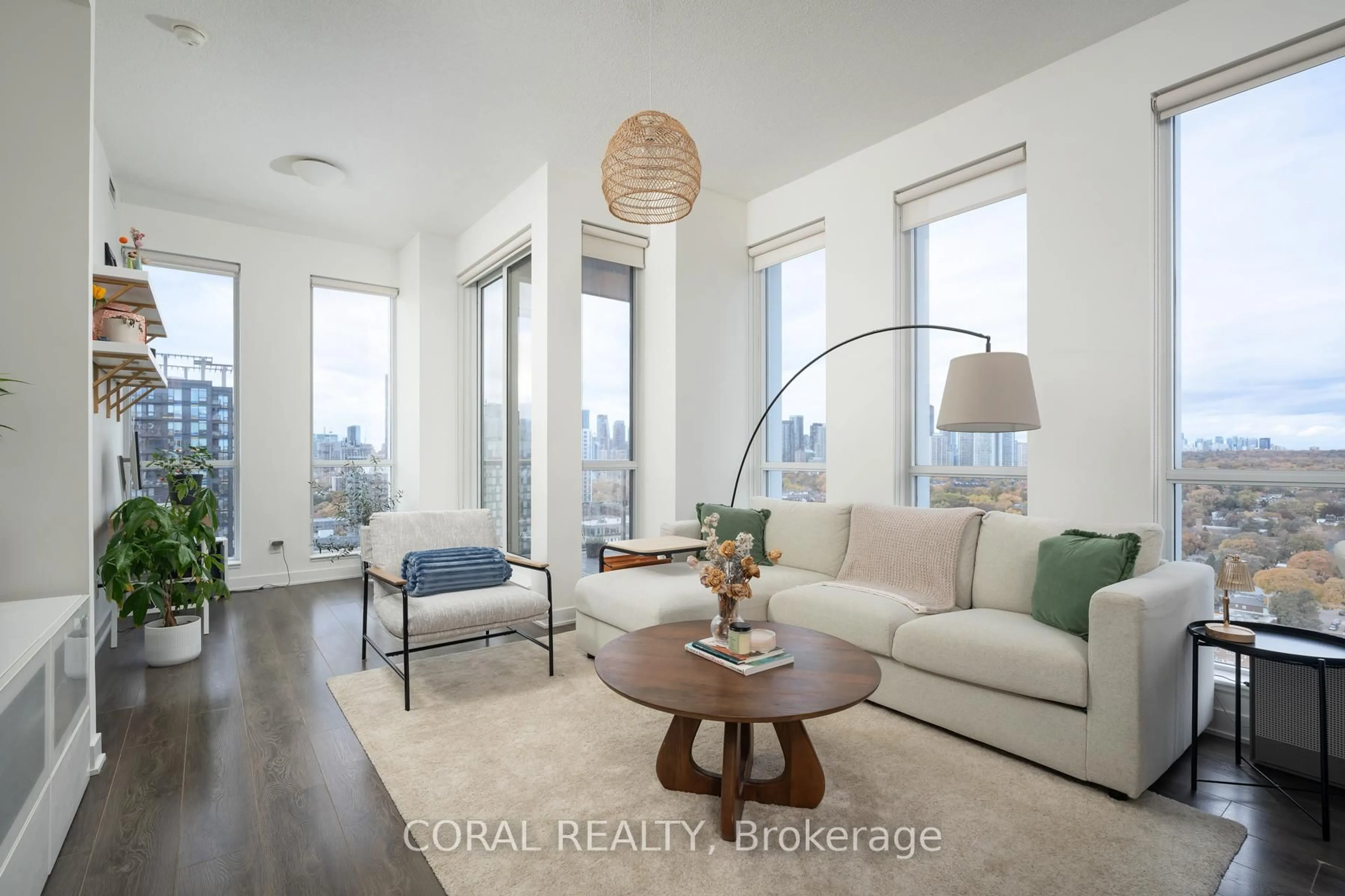 Living room with furniture, wood/laminate floor for 170 Sumach St #2409, Toronto Ontario M5A 0C3