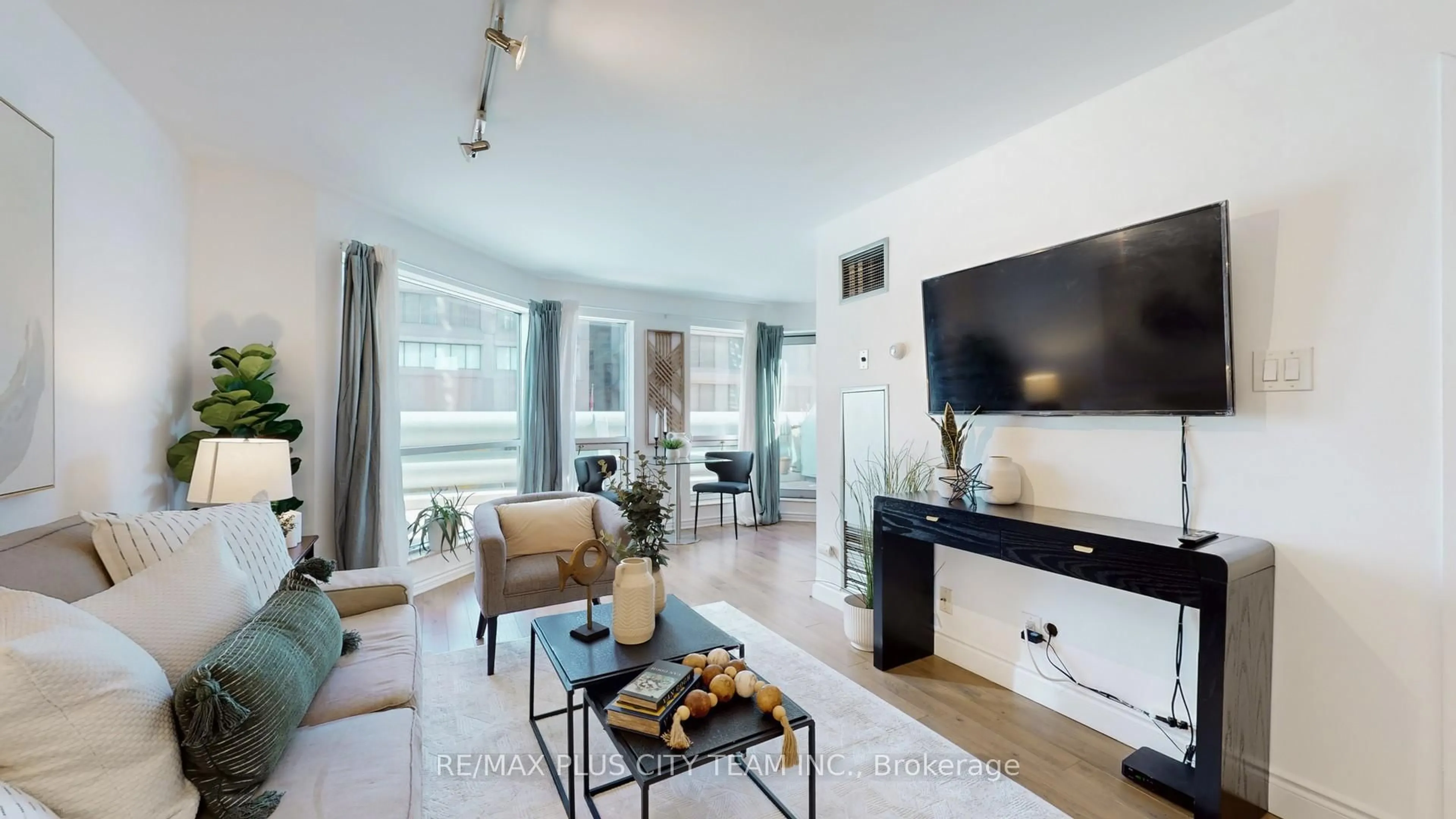 Living room with furniture, wood/laminate floor for 10 Yonge St #310, Toronto Ontario M5E 1R4