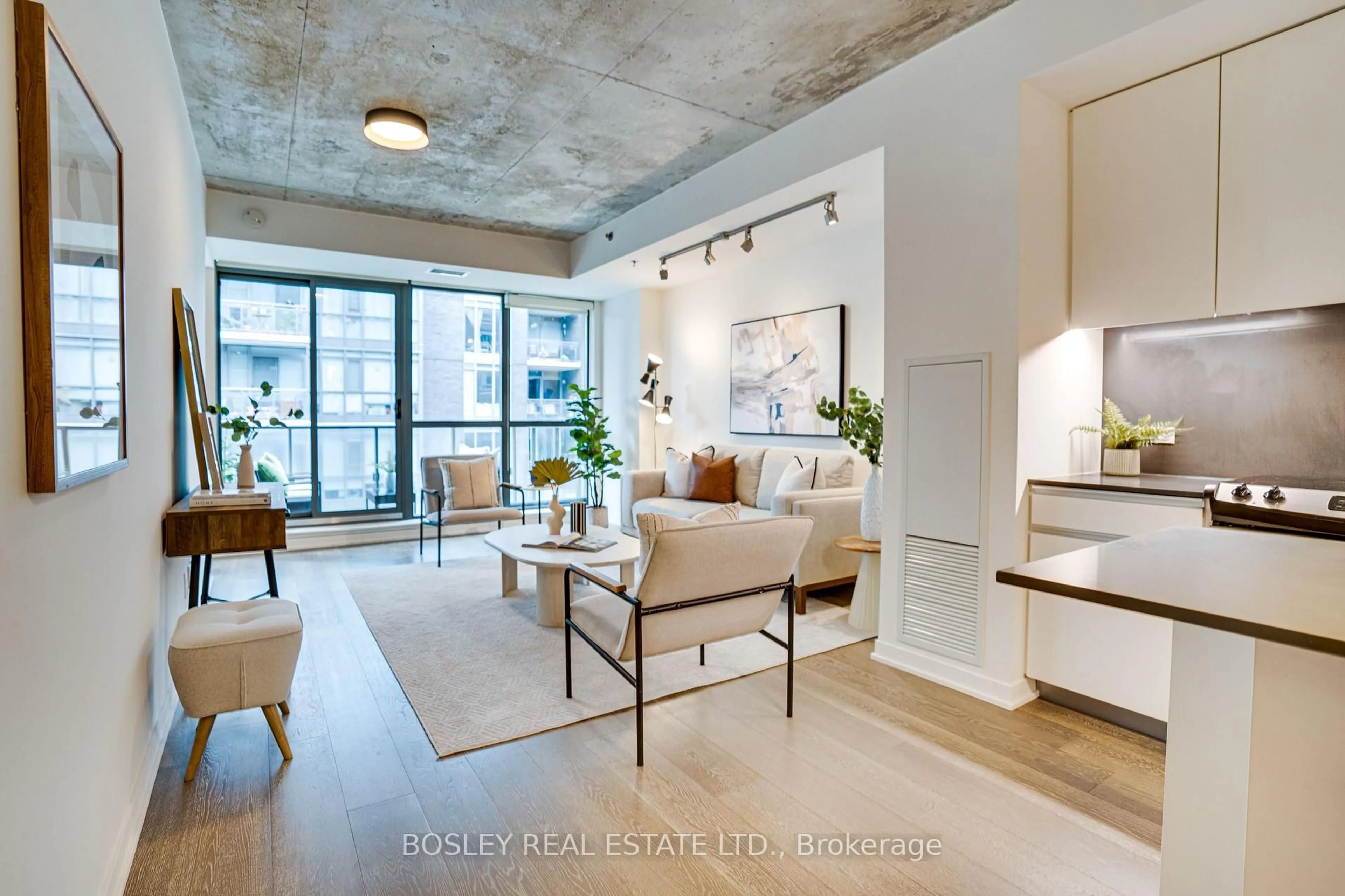 Living room with furniture, cement floor for 8 Gladstone Ave #403, Toronto Ontario M6J 0B3