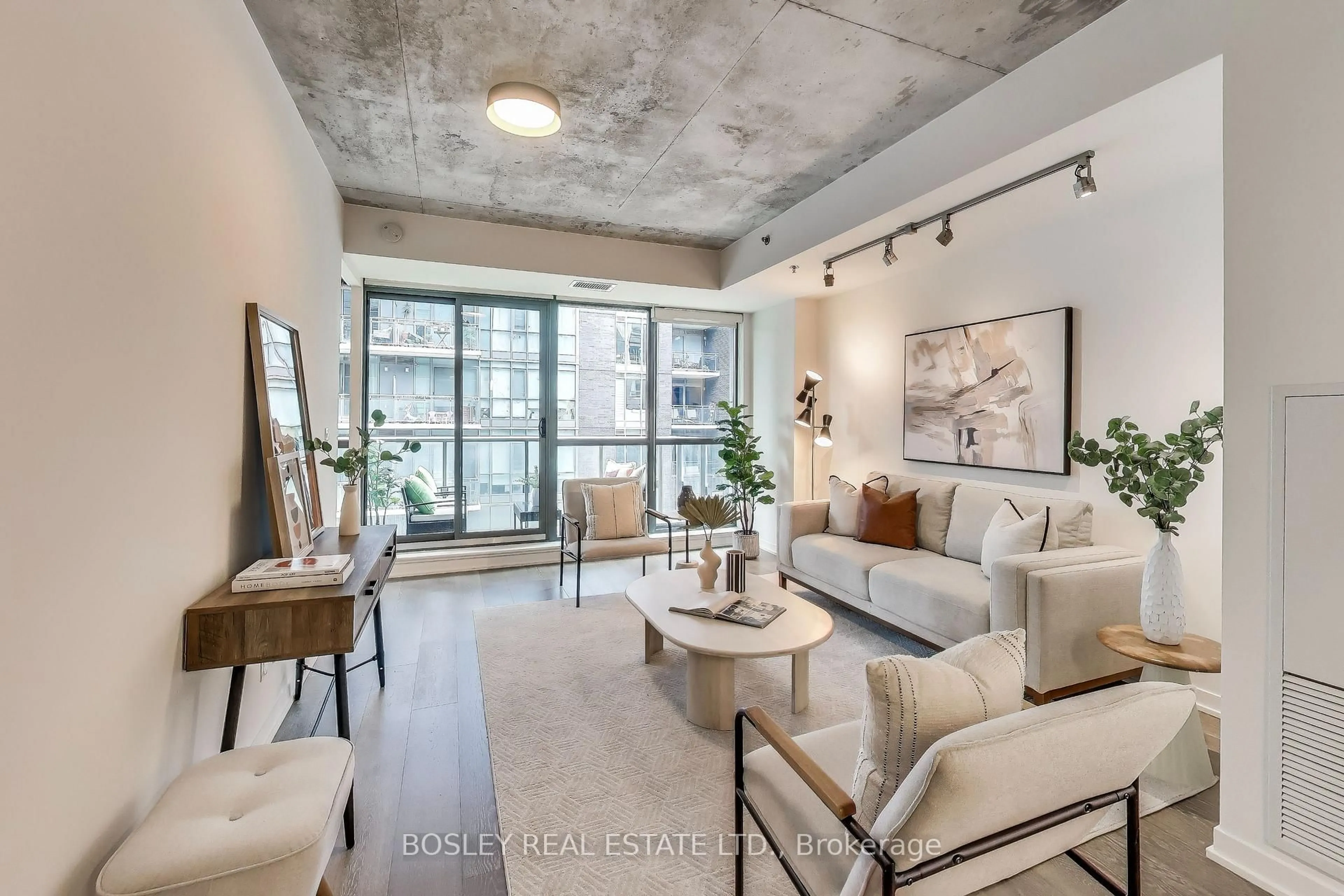 Living room with furniture, cement floor for 8 Gladstone Ave #403, Toronto Ontario M6J 0B3