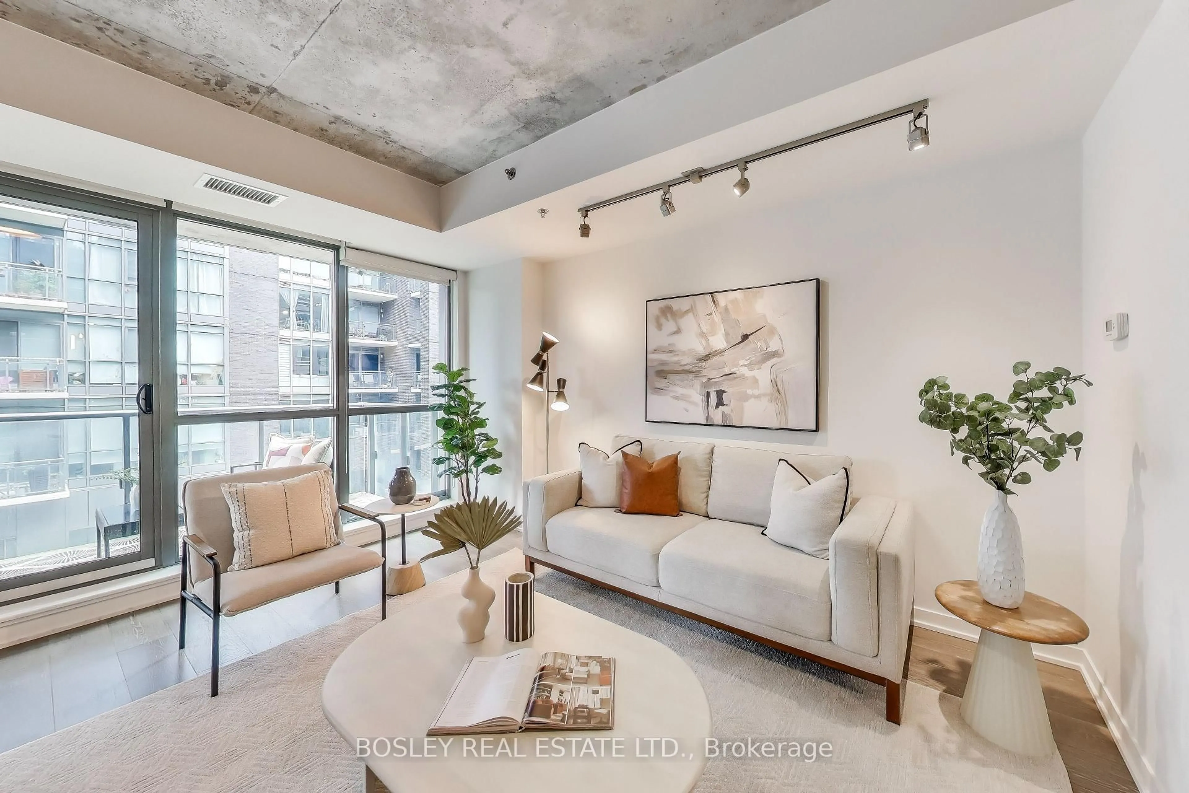 Living room with furniture, cement floor for 8 Gladstone Ave #403, Toronto Ontario M6J 0B3