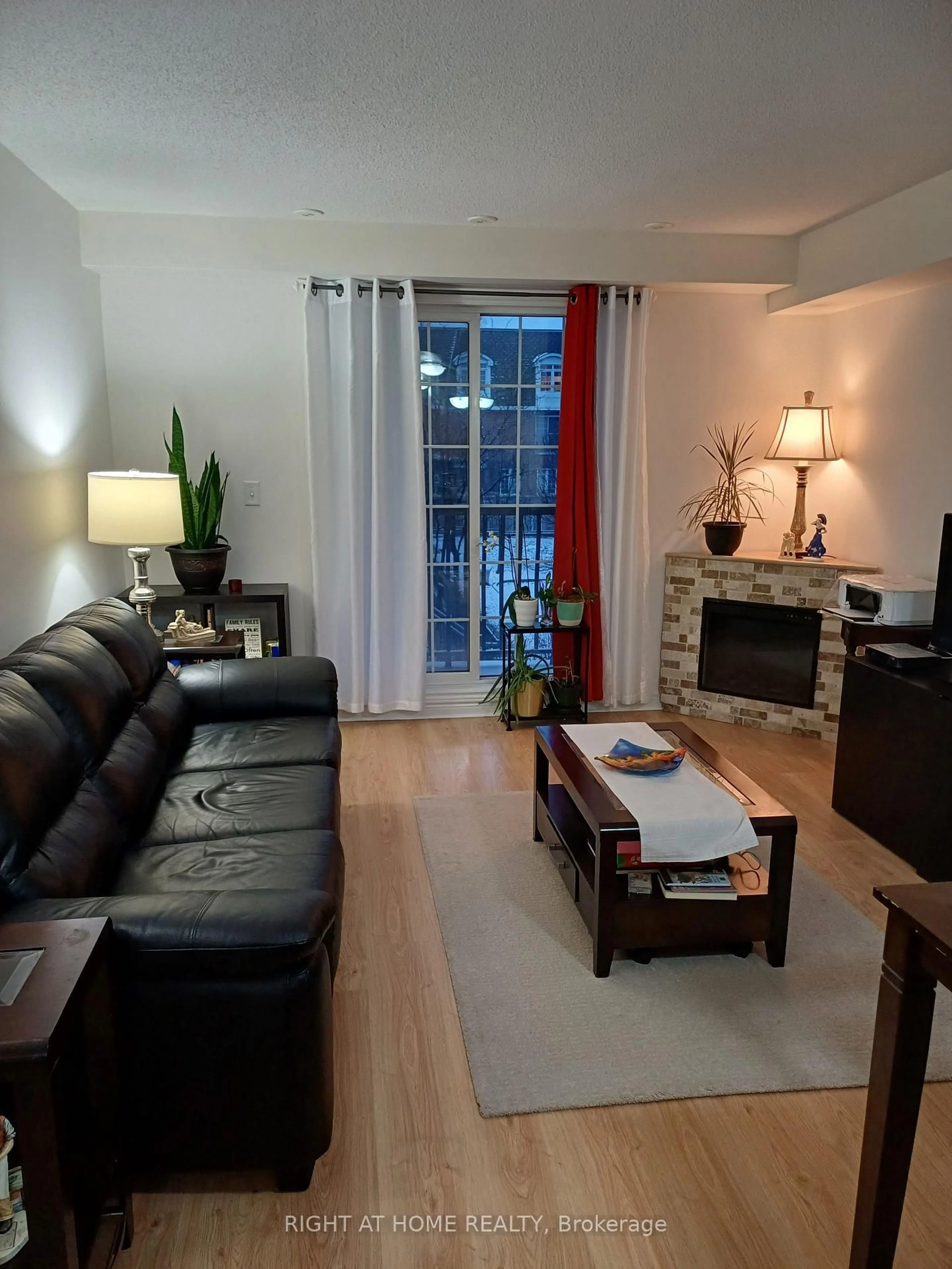 Living room with furniture, wood/laminate floor for 45 Cedarcroft Blvd #12, Toronto Ontario M2R 3Y2
