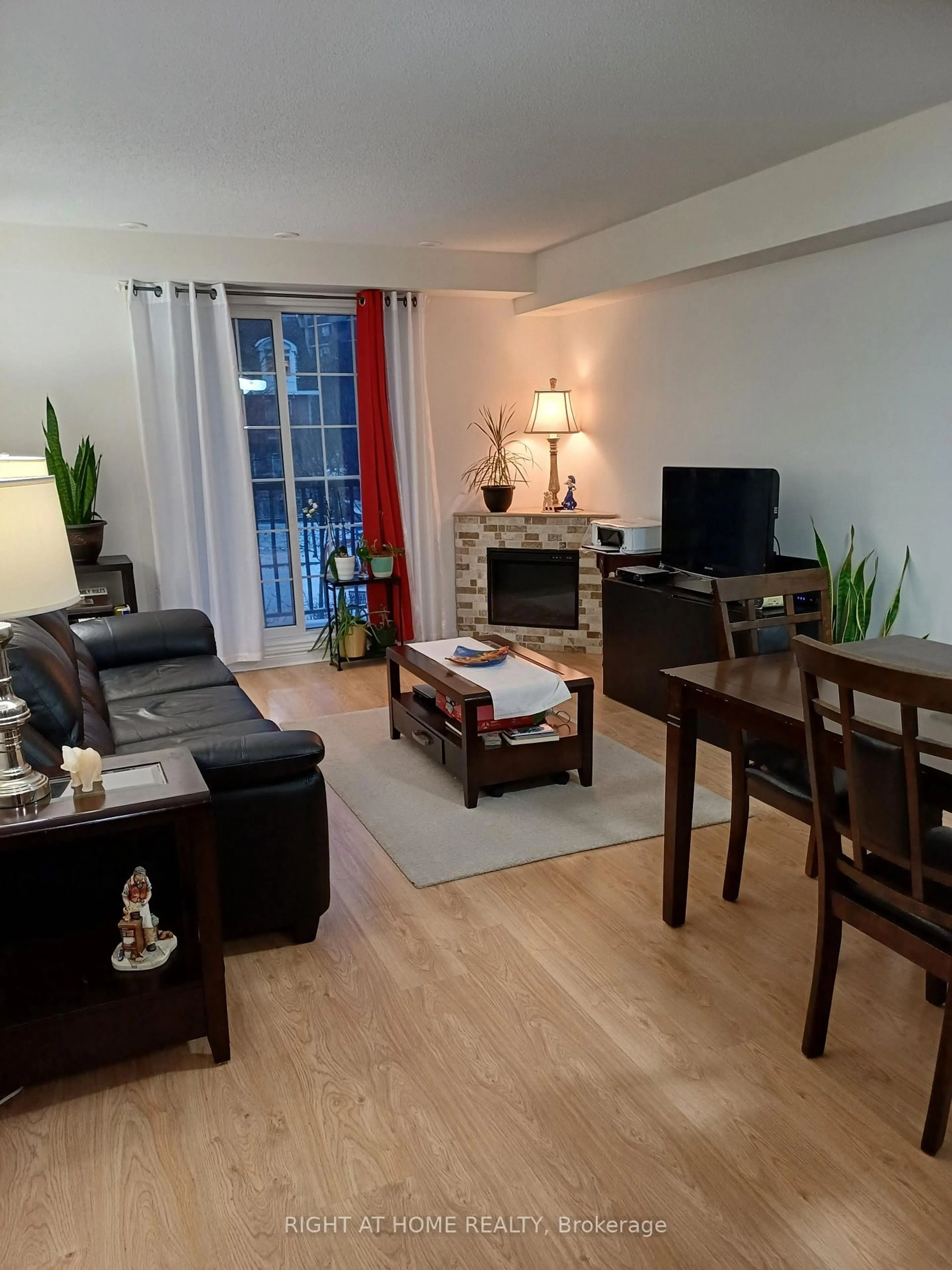 Living room with furniture, wood/laminate floor for 45 Cedarcroft Blvd #12, Toronto Ontario M2R 3Y2
