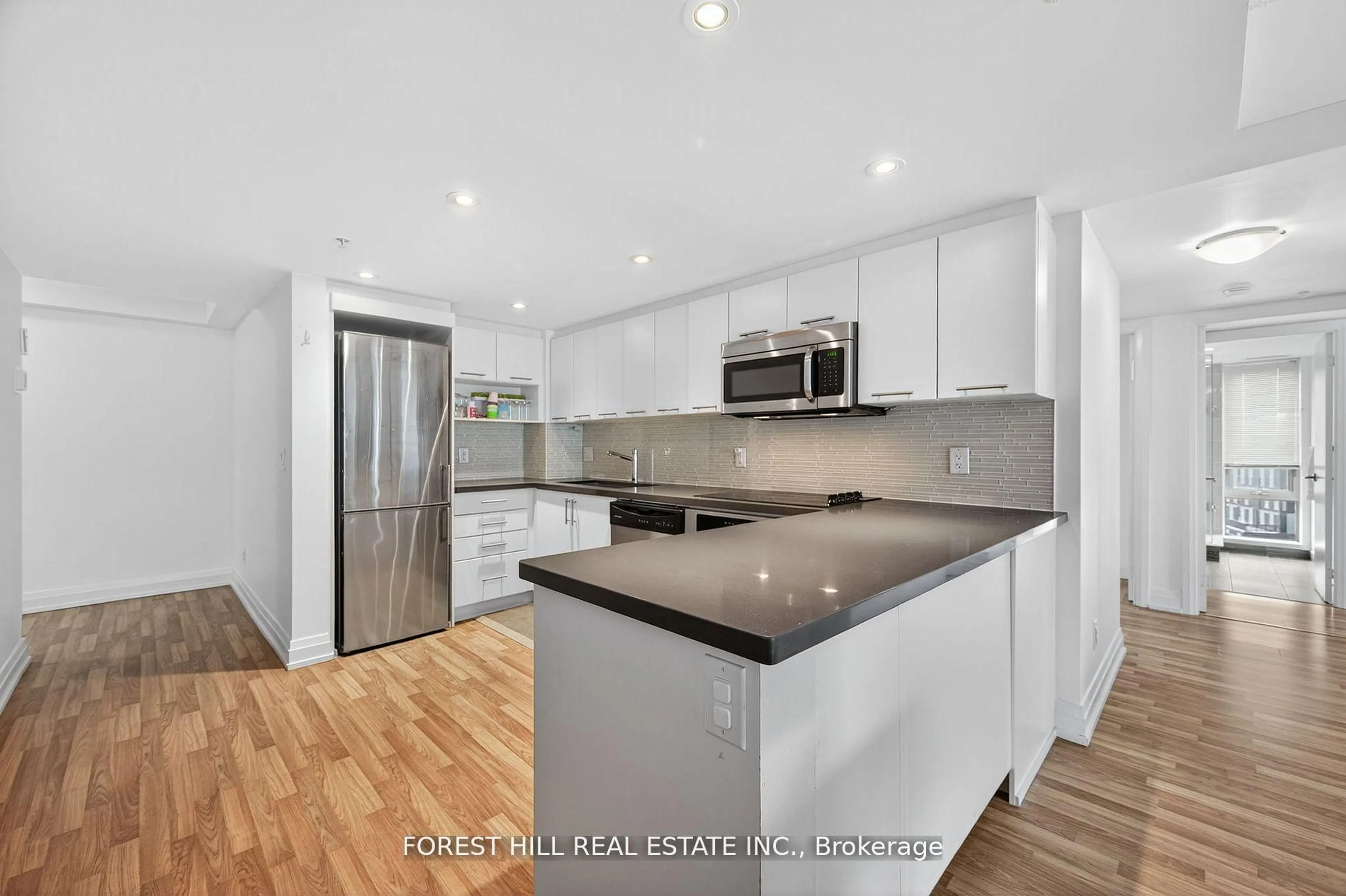 Open concept kitchen, wood/laminate floor for 565 Wilson Ave #W1204, Toronto Ontario M3H 0C6