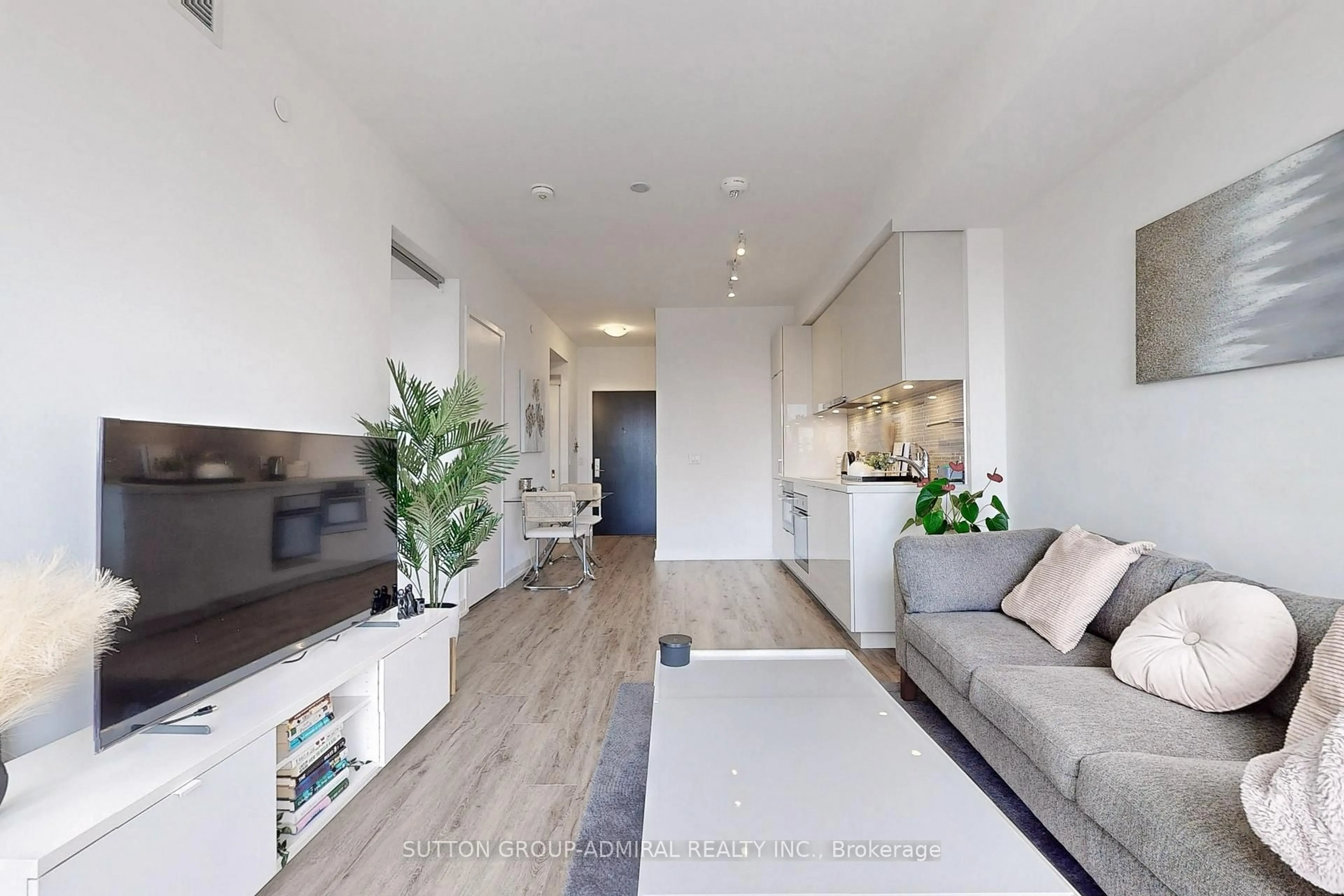 Living room with furniture, wood/laminate floor for 158 Front St #1412, Toronto Ontario M5A 0K9