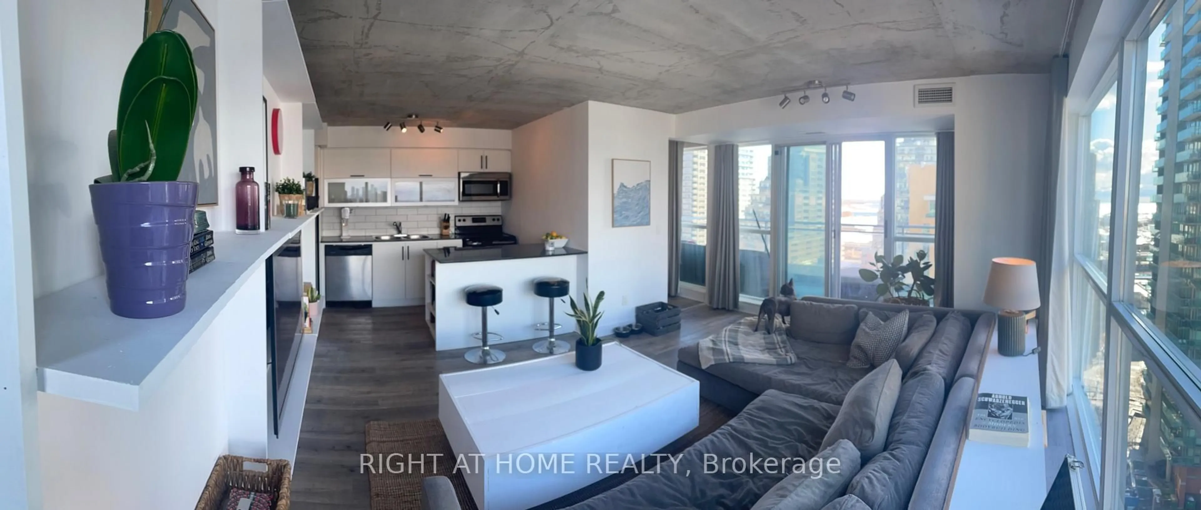 Living room with furniture, cement floor for 100 Western Battery Rd #1603, Toronto Ontario M6K 3S2