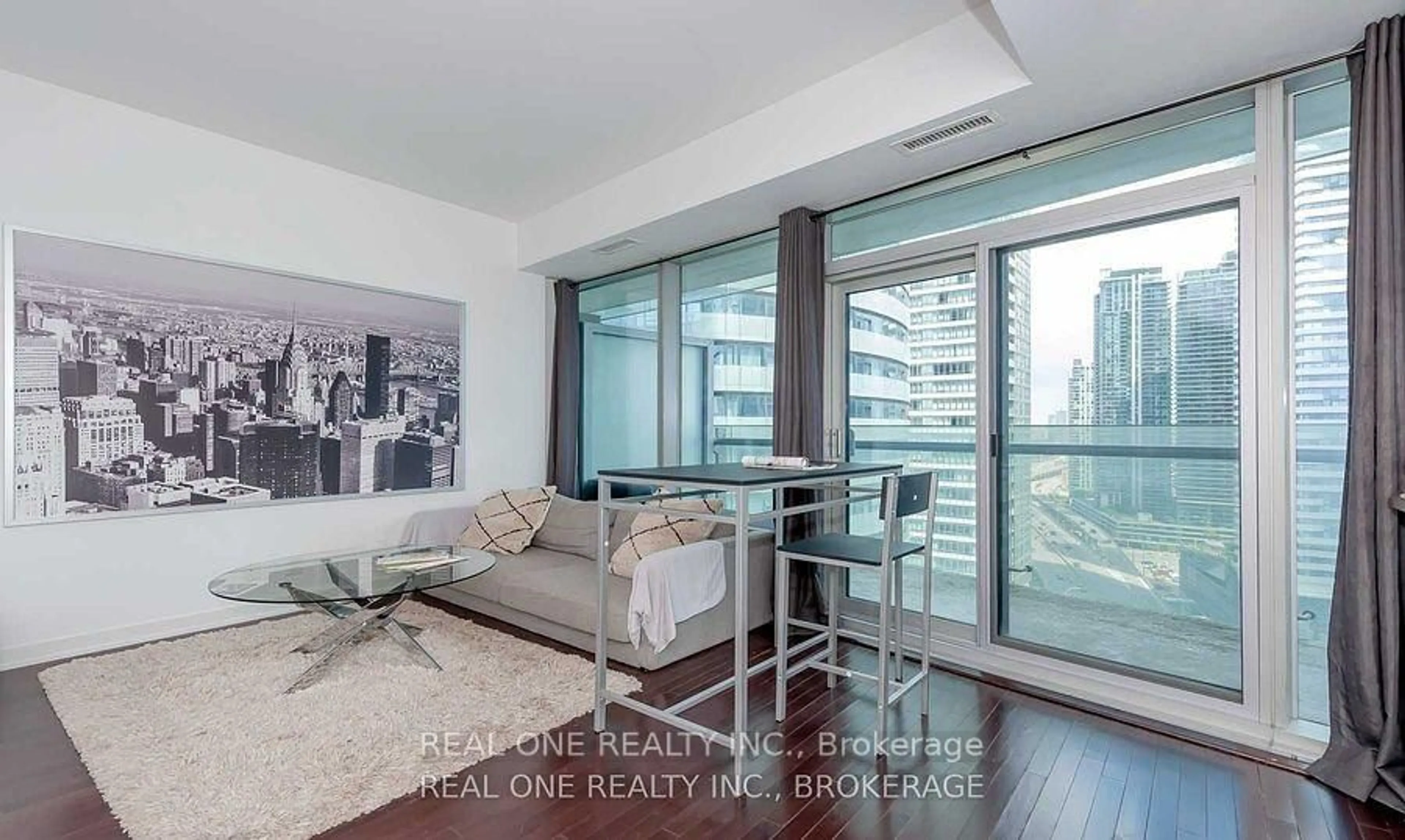 Living room with furniture, wood/laminate floor for 12 York St #2001, Toronto Ontario M5J 0A9