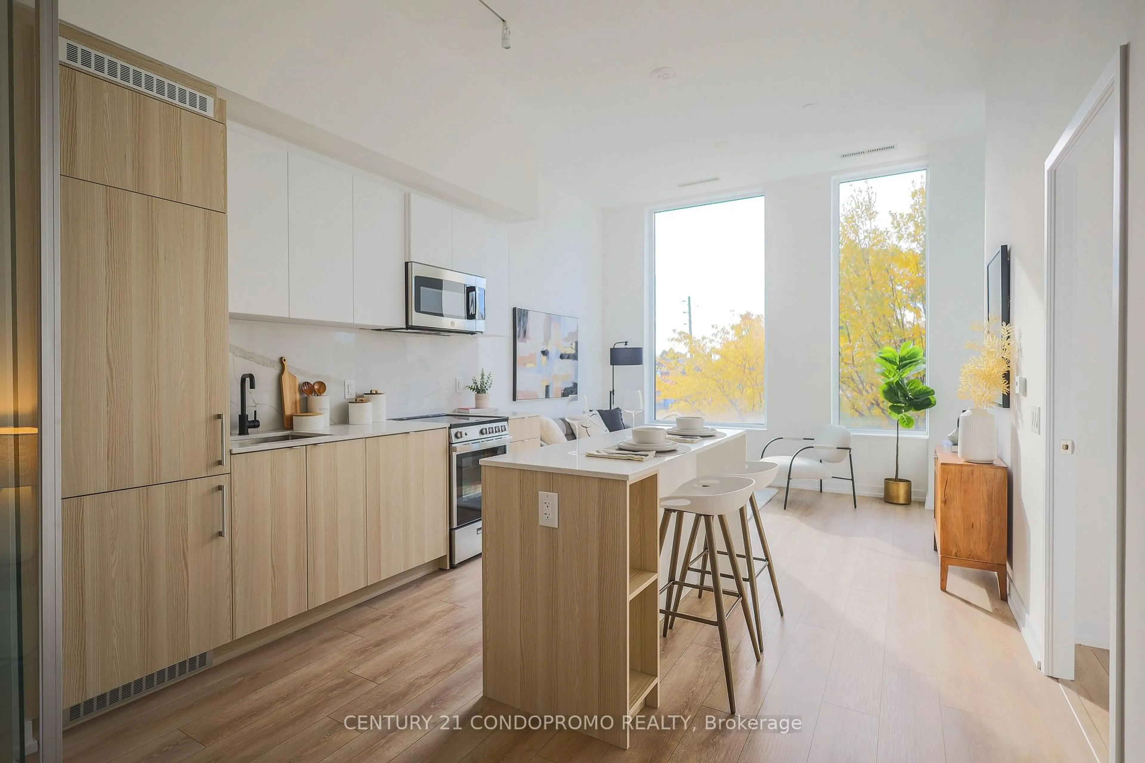 Open concept kitchen, wood/laminate floor for 500 Dupont St #213, Toronto Ontario M6G 1Y7