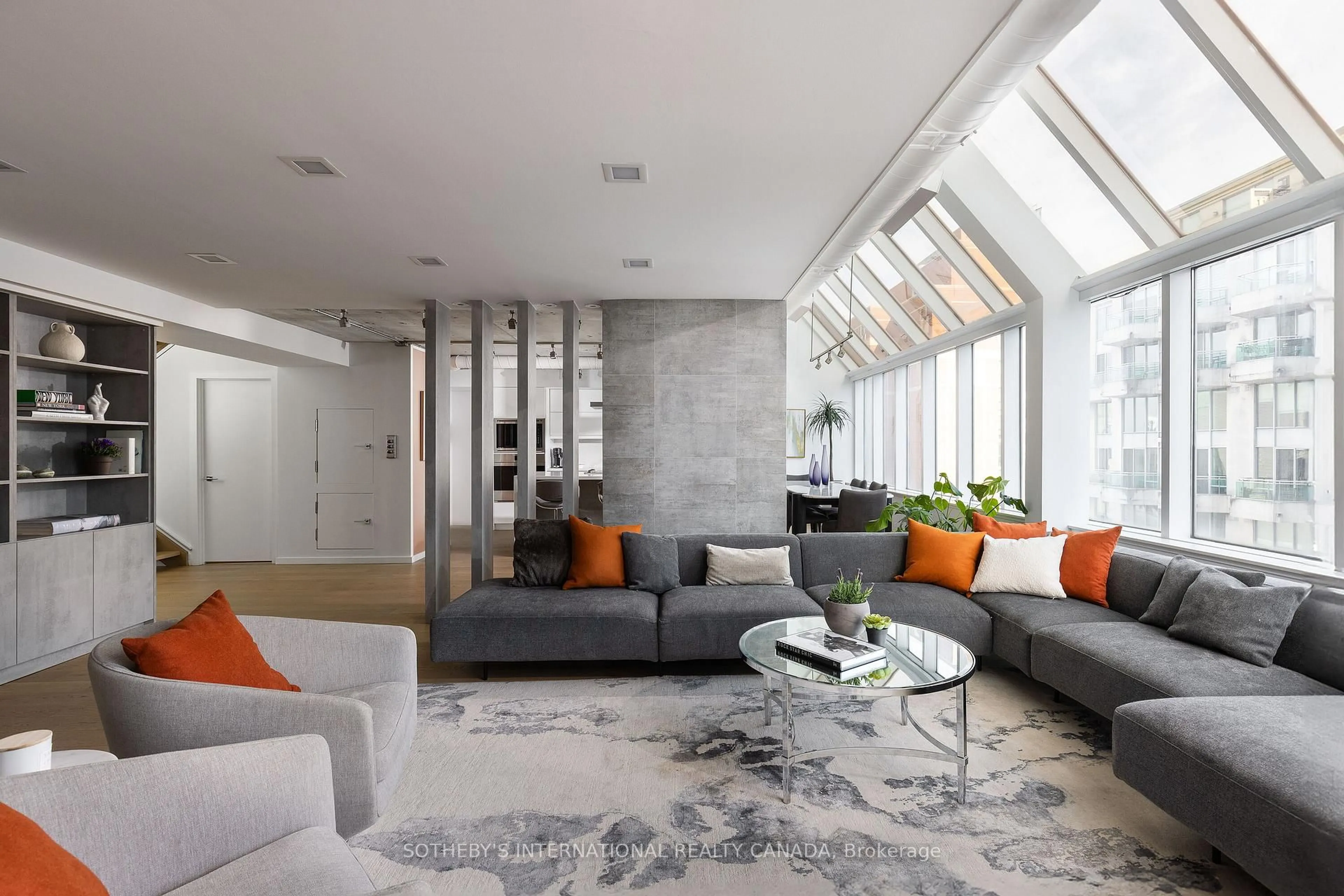 Living room with furniture, cement floor for 82 Lombard St #PH 912, Toronto Ontario M5C 2S8